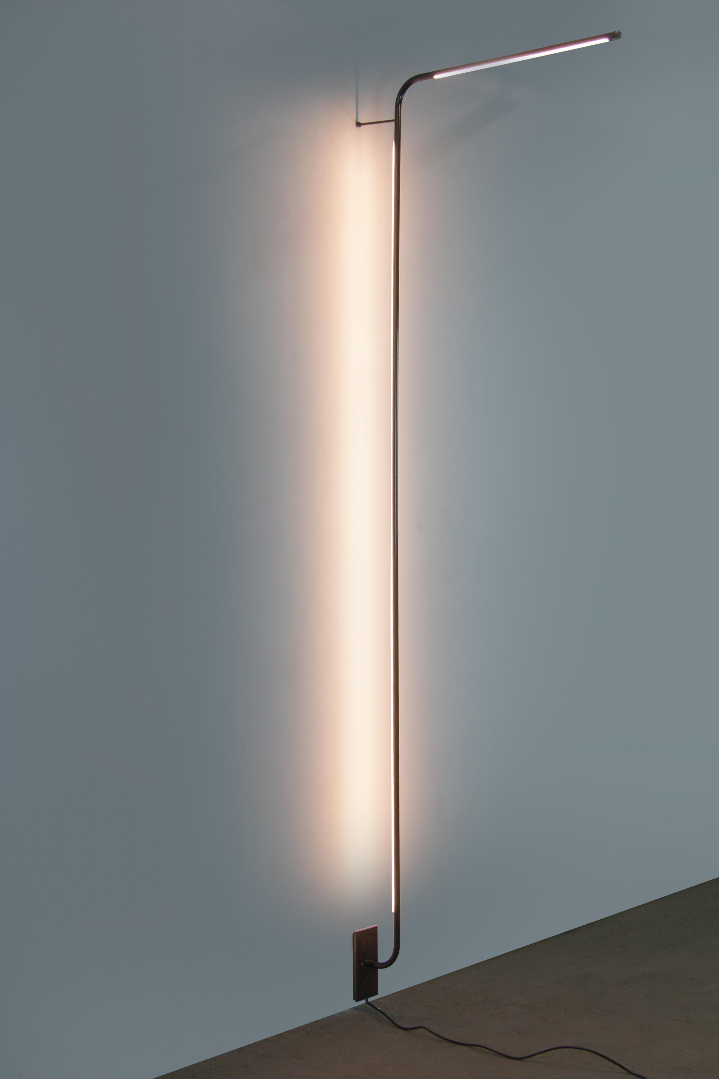 Tube darkened brass wall lamp by Gentner Design
Dimensions: D 68.5 x W 7.5 x H 221 cm
Materials: darkened brass
Available in darkened brass and hand rubbed brass.

All our lamps can be wired according to each country. If sold to the USA it will
