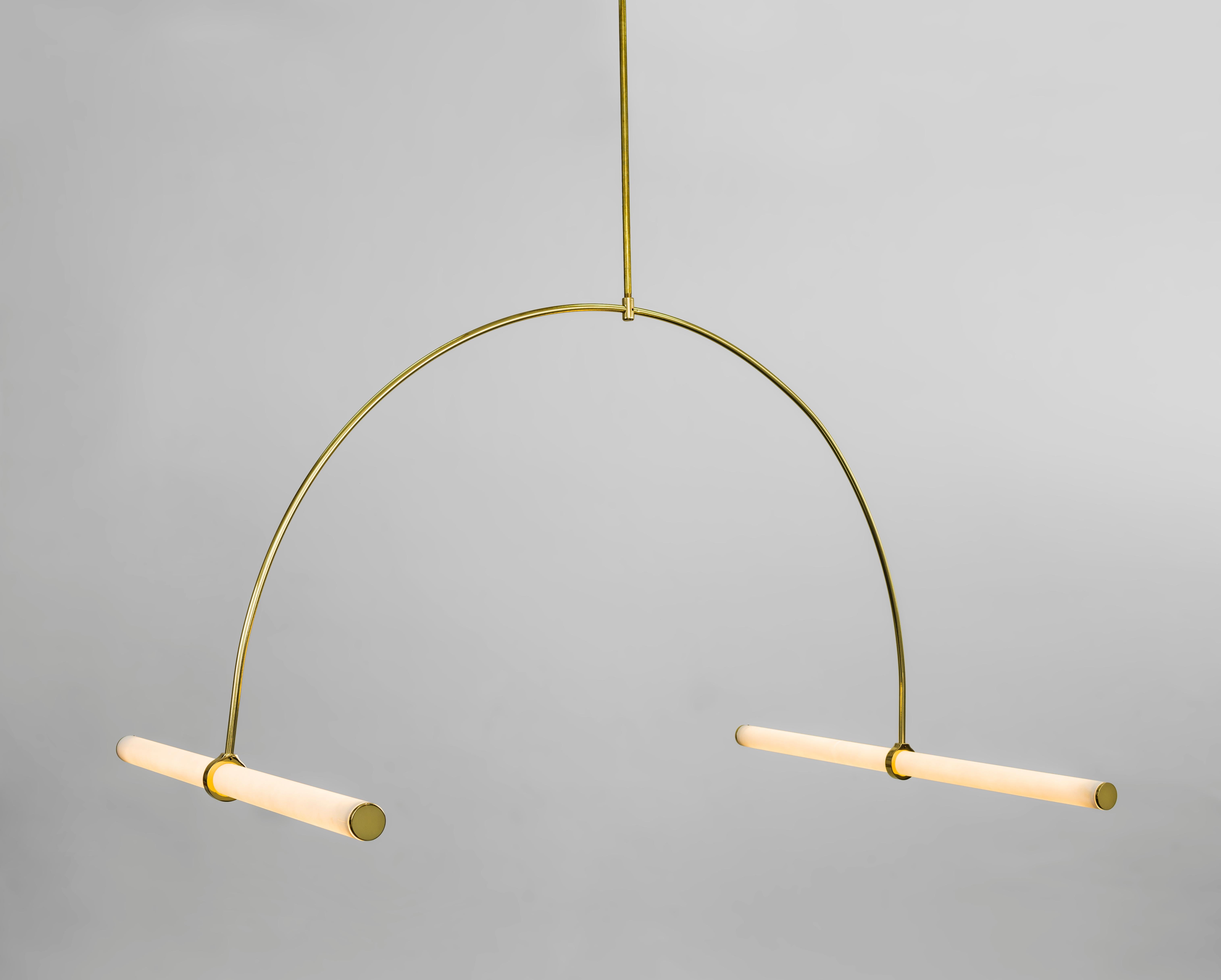 Tube pendant No. 1 by Naama Hofman
Dimensions: W 106, H 124 cm (height to order)
Light tube diameter: 35 mm
Brass pipe diameter: 10 mm
Number of light tubes: 2
Voltage: 110-240
CE Approved
Material : Polished Brass pipe, Acrylic tube, LED