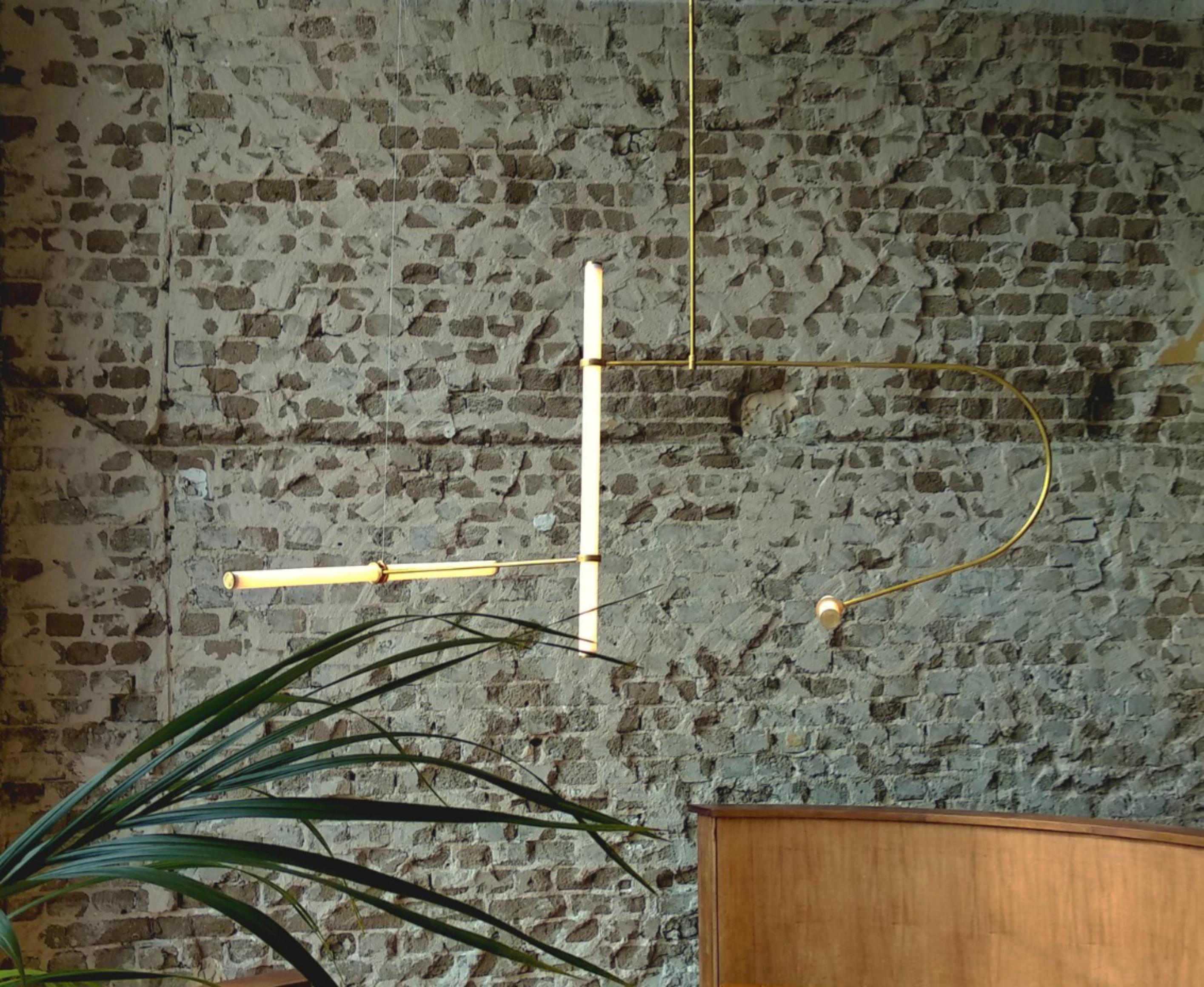 Tube pendant no. 2 by Naama Hofman
Dimensions: 140 x 139 cm (height to order).
Light tube diameter: 35 mm.
Brass pipe diameter: 10 mm.
Materials: Polished brass pipe, acrylic tube, LED lights.

Number of light tubes: 3
Voltage: 110-240.
CE