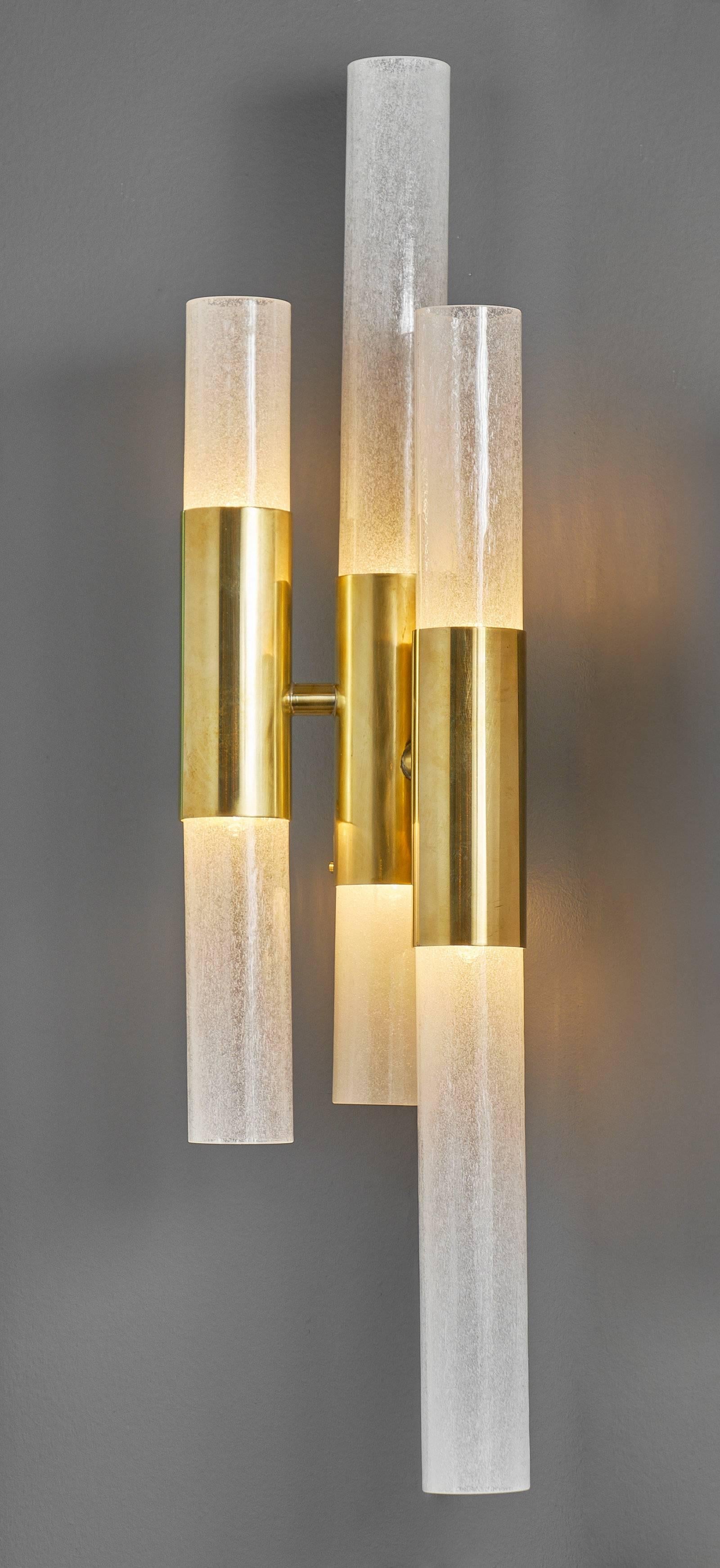 Pair of Murano glass tube sconces each featuring “pulegoso” tubes with a gilt brass tubular structure. This pair has been newly wired for US standards.