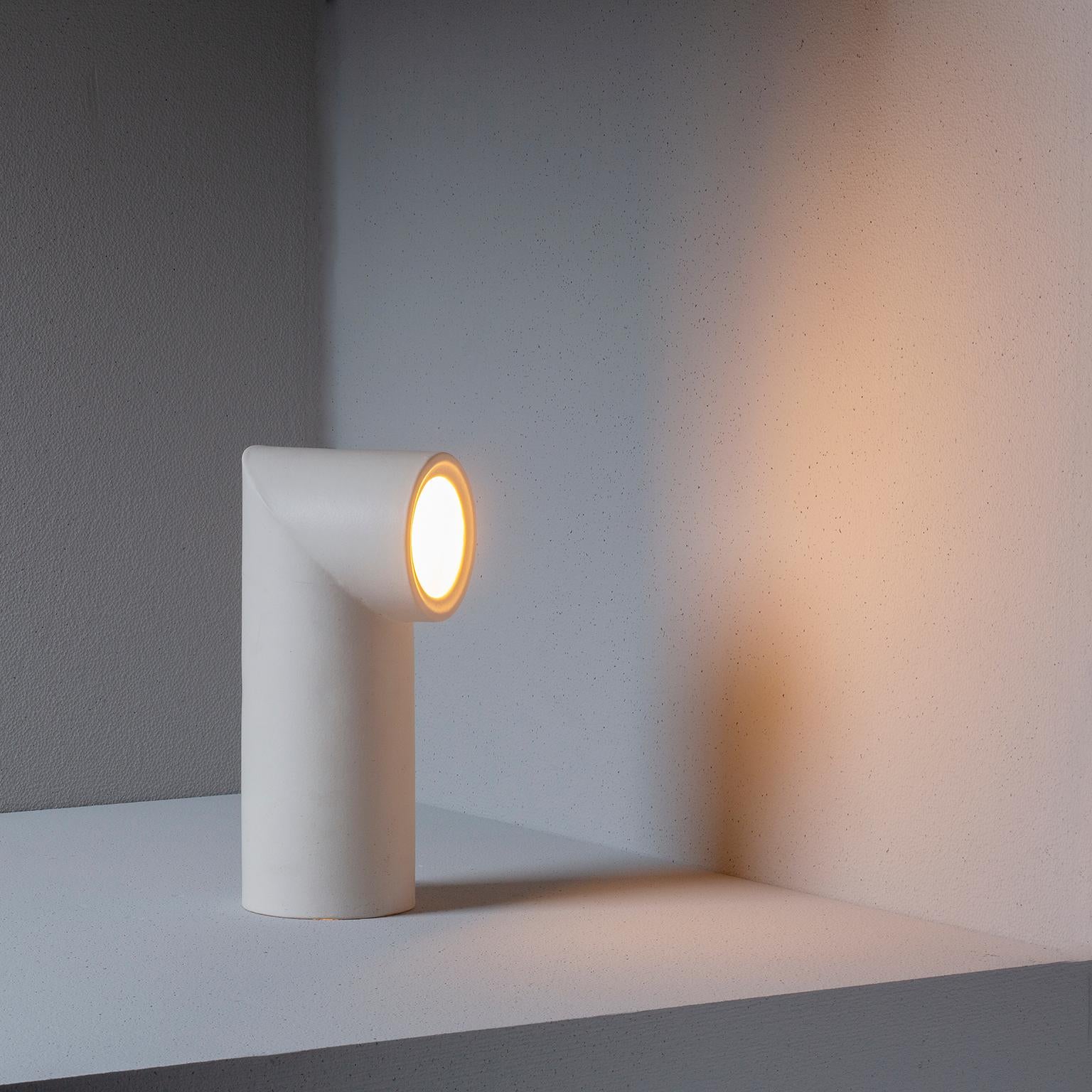 Tubes
Ceramic table lamp, a stereotypical element inspired by minimalism and Industrial archaeology. The base is turned on a potter’s wheel, cut at an angle of 45° and rebuilt in the opposite direction. It requires a simple 7v. LED light. This lamp