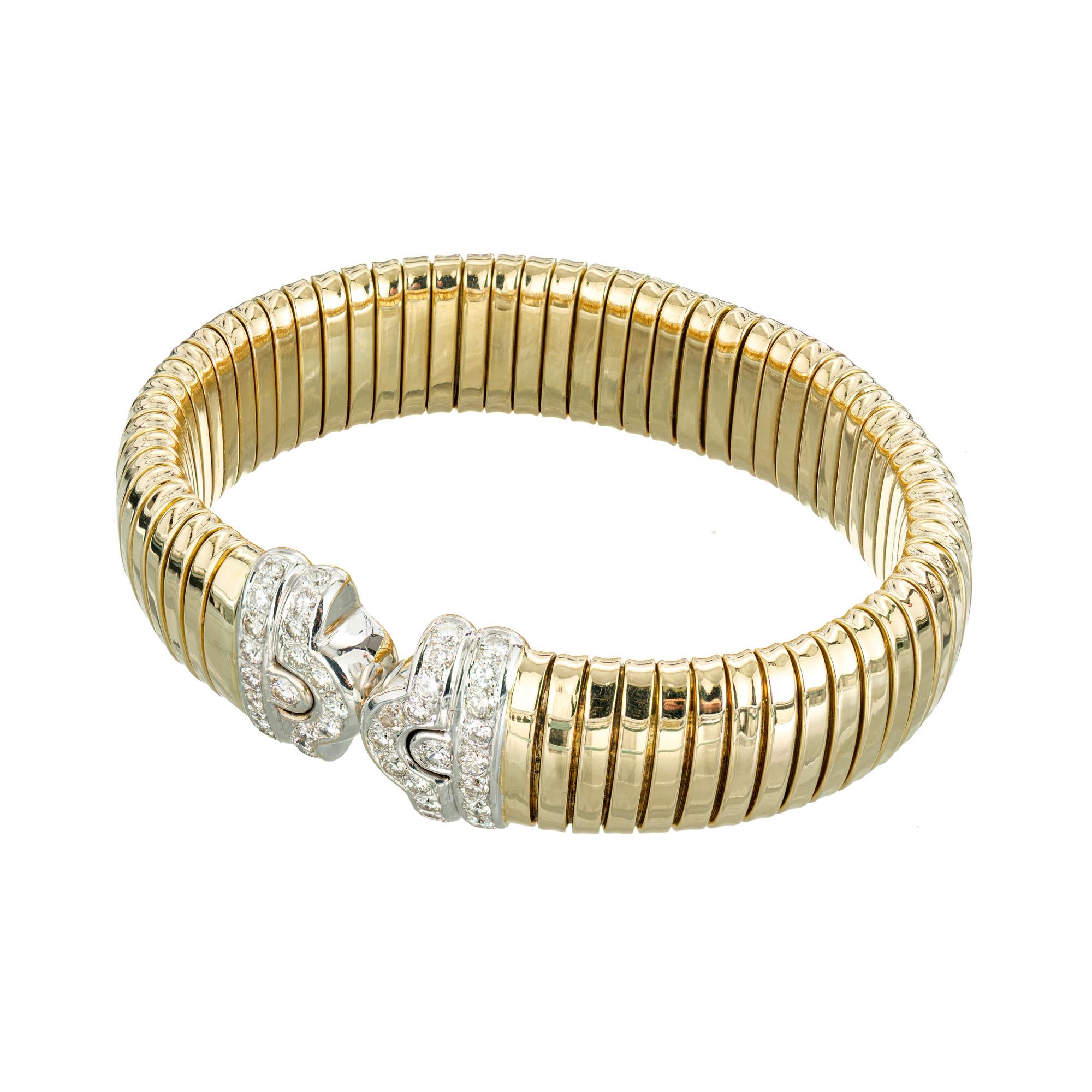 Tubogas diamond bangle bracelet. 42 round diamonds set in 18k white and yellow gold spring loaded bracelet. 7-7.25 wrist. Circa 1970-1980. 

40 round diamonds, approx. total weight 1.20cts, F, VS – SI
2 round diamonds, approx. total weight .16cts,