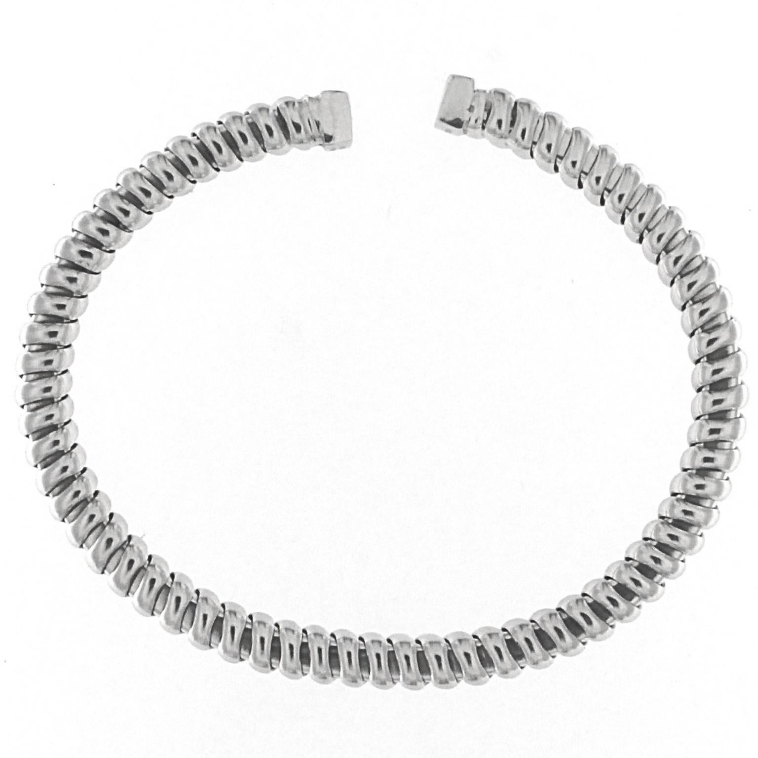 Description:
This stunning white gold bracelet, crafted in the signature tubogas style, is designed to perfectly fit the wrist. Forged on a custom template, it ensures both elegance and comfort. The bracelet stretches effortlessly due to the white