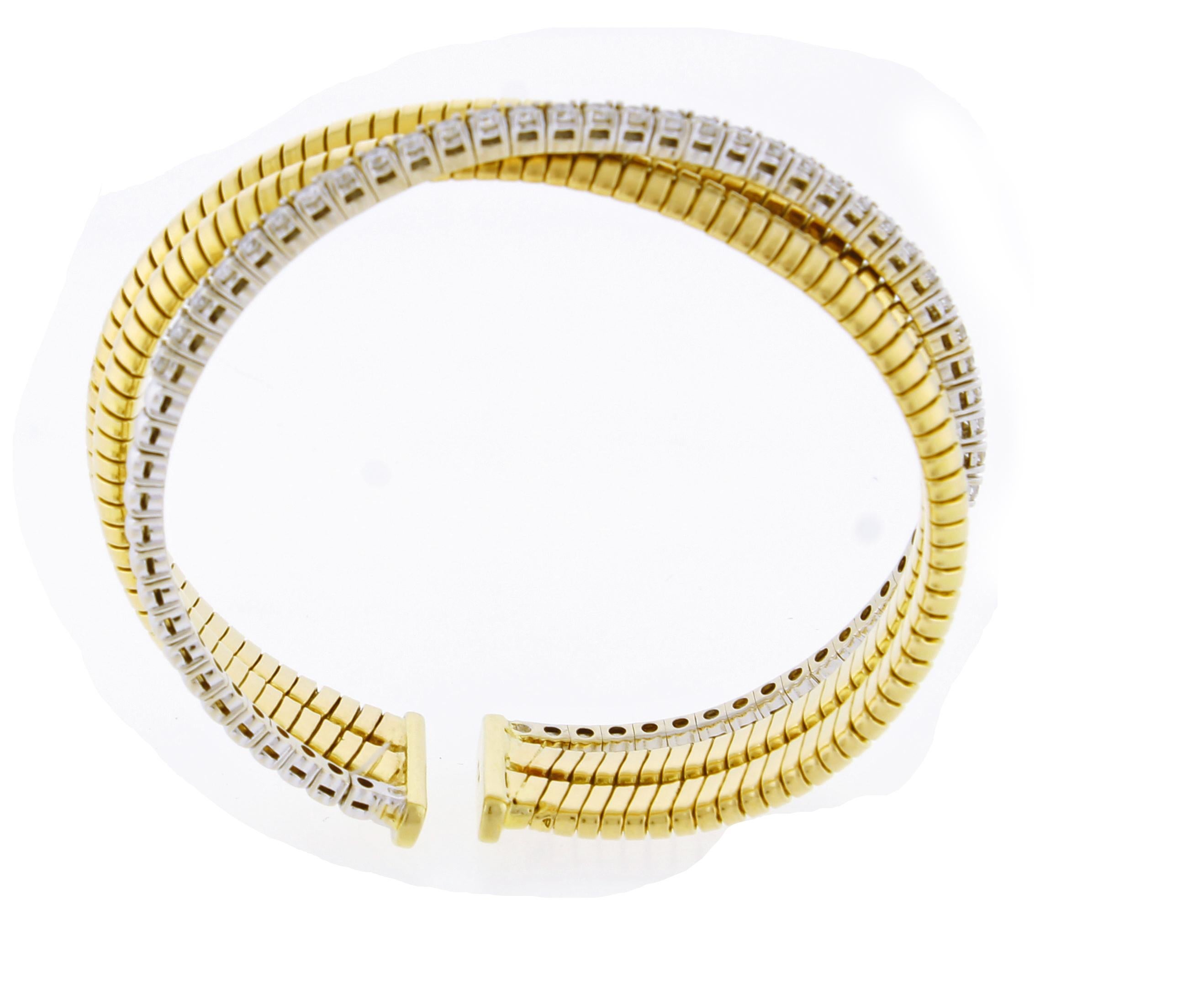 A three row Italian diamond tubagas flexible cuff bangle bracelet
♦  Metal: 18 karat white and yellow gold
♦  Circa 1980s
♦  33 Diamonds=1.40 cts
♦  Each yellow section 6mm wide, diamonds section 2.5mm wide
♦  Fits a 6 each wrist
♦ Packaging: