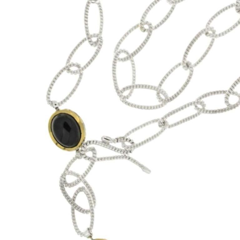925 Sterling silver and gold tubogas long link necklace with 3 natural duble face stones.

Long strands of gold or silver are crafted from slabs woven together to give the tubular shape we know, suitable for every moment, perfect for every