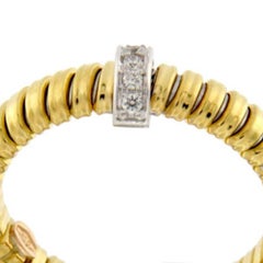 Tubogas yellow gold thin ring with brilliants.
