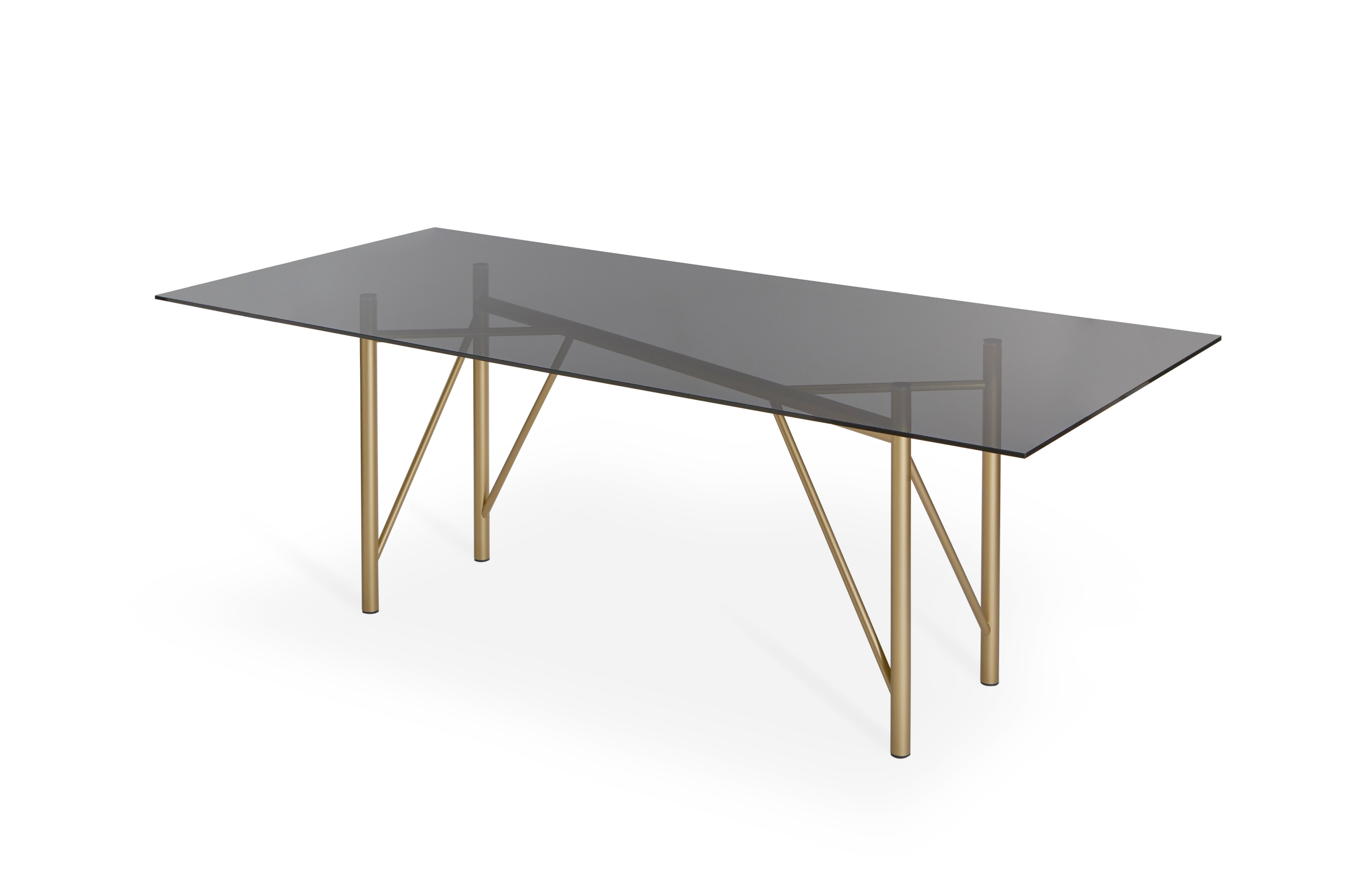Tubolar table by Mentemano
Dimensions: W 220 x D 100 x H 75 cm
Materials: painted matt brass, smoked grey top

The project is based on lightness and attention to details. Volumes and lines are the result of technical and aesthetic process