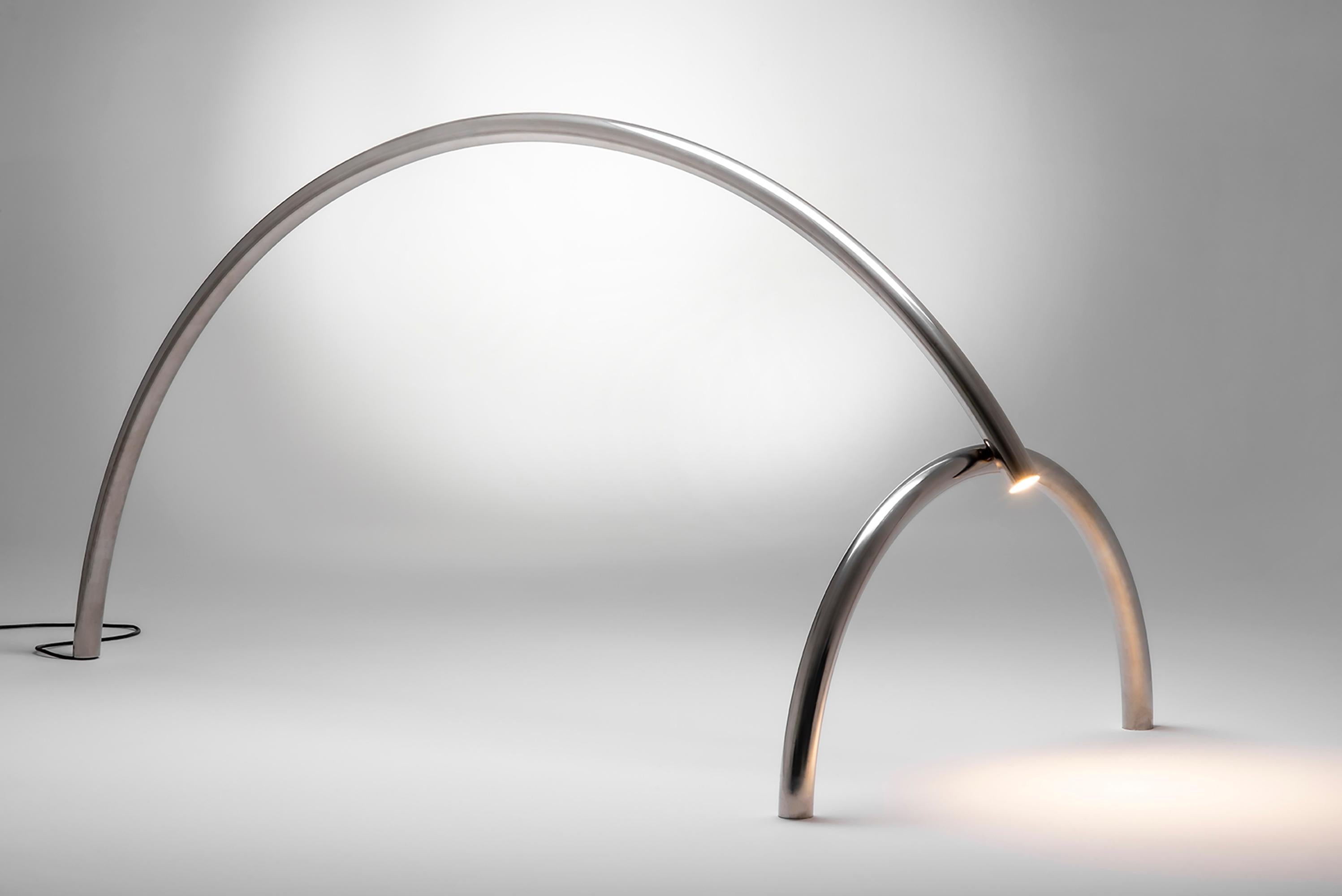 Tubs i Llums 02 is a 2m long striking floor lamp by Barcelona-based designer Max Enrich, part of a limited-edition series exploring the intersection of industrial materials and sculptural lighting. Crafted in polished stainless steel, this unique