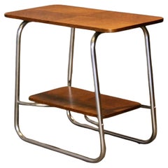 Mesa de té tubular y de madera