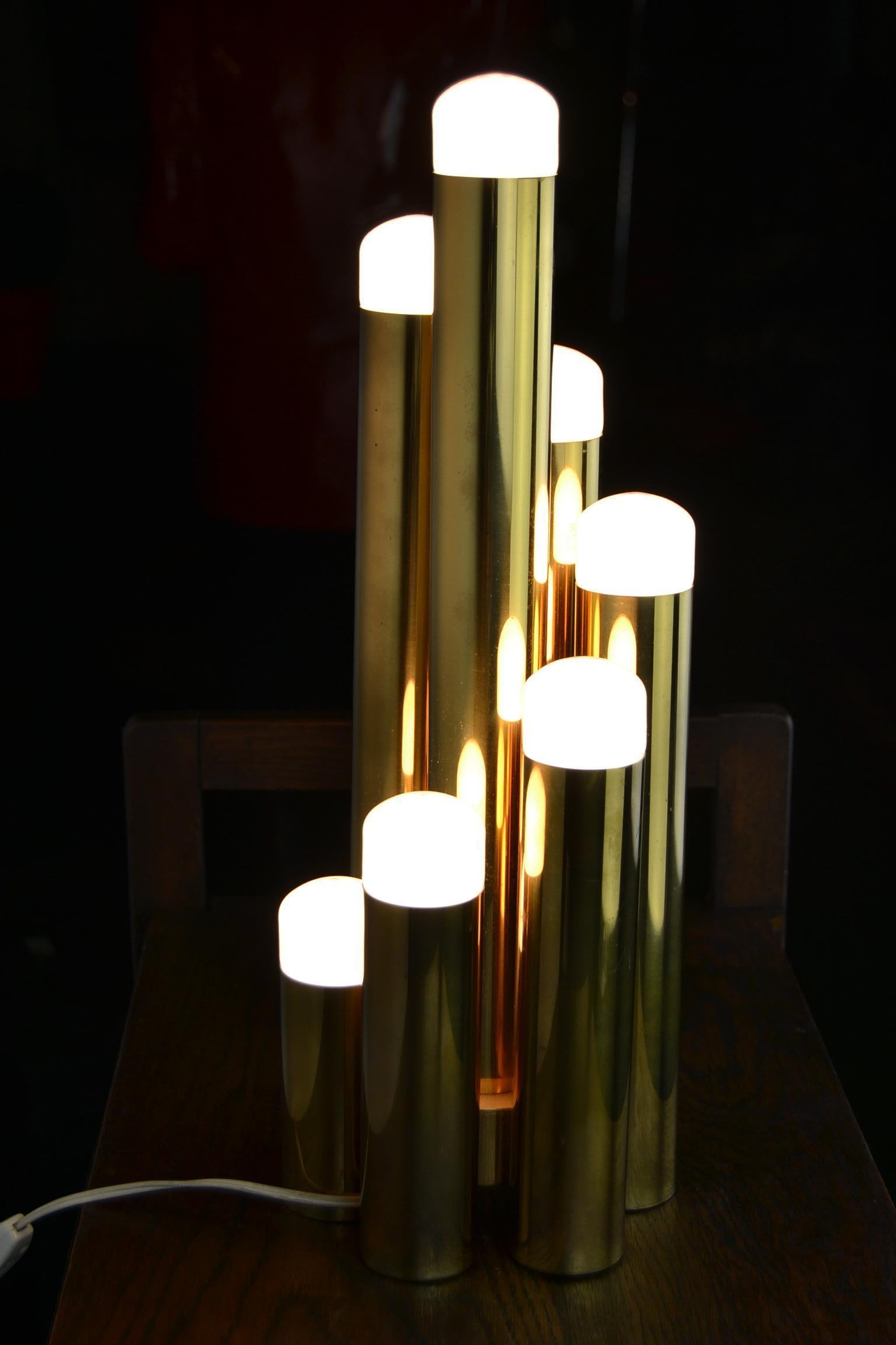 Stylish Brass Tubular, Tube-Shaped Table lamp for Boulanger by Gaetano Sciolari  from the 1970s. 

This Messing table lamp has 7 light points with E14 fitting.
It will be sold included the original Old European bulbs which were designed for the