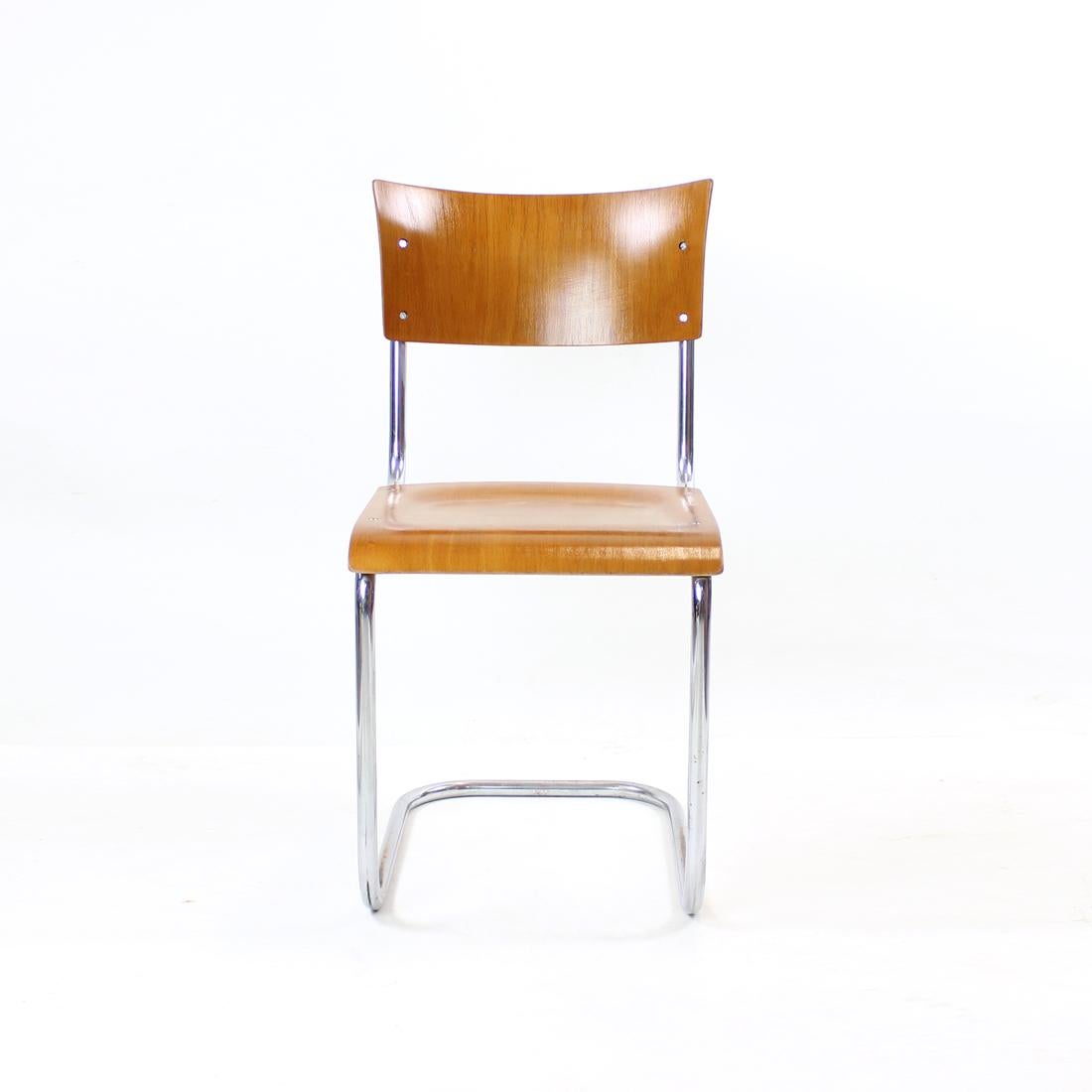 Iconic chair of the 20th century. Produced in midcentury era out of bent chrome pipe construction. Molded plywood seat and backrest. Original design by Mart Stam for the Thonet company. In Czechoslovakia the chairs were manufactured by Kovona