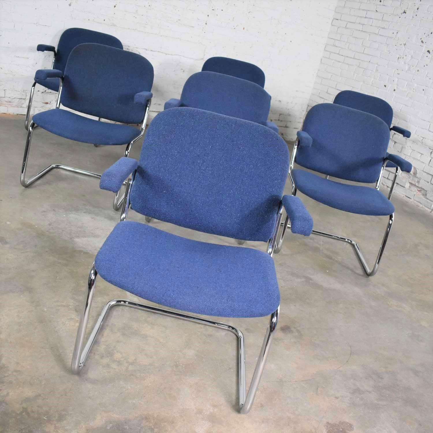 Awesome vintage cantilever tubular chrome and blue hopsack fabric upholstered lounge chairs in the manner of Thonet. There are set of seven chairs available. All are in wonderful vintage condition with normal wear for their age. The upholstery has