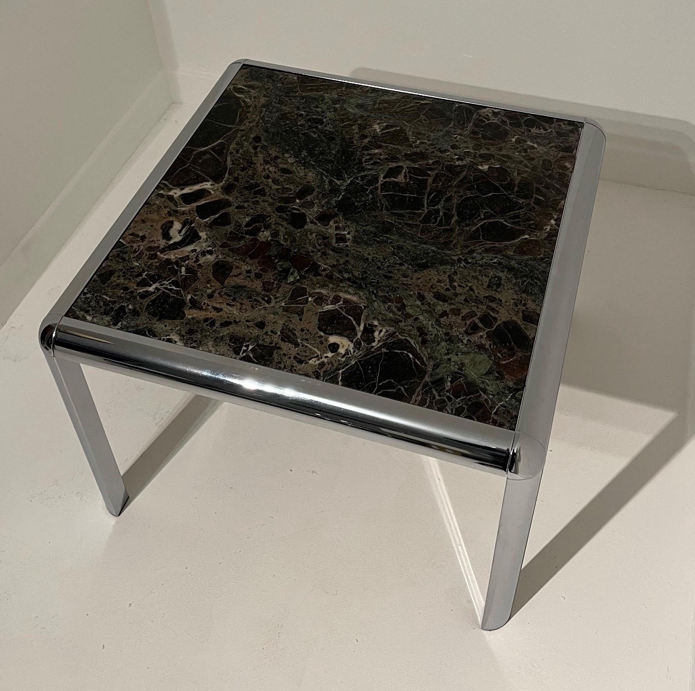 Beautiful Marble and Chrome Coffee Table.
Heavy chrome base with rounded shoulders. 
Similar styles found in Italy and in America under DIA. 
Marble has some very light scratches but overall very good condition. Chrome is in excellent condition. 