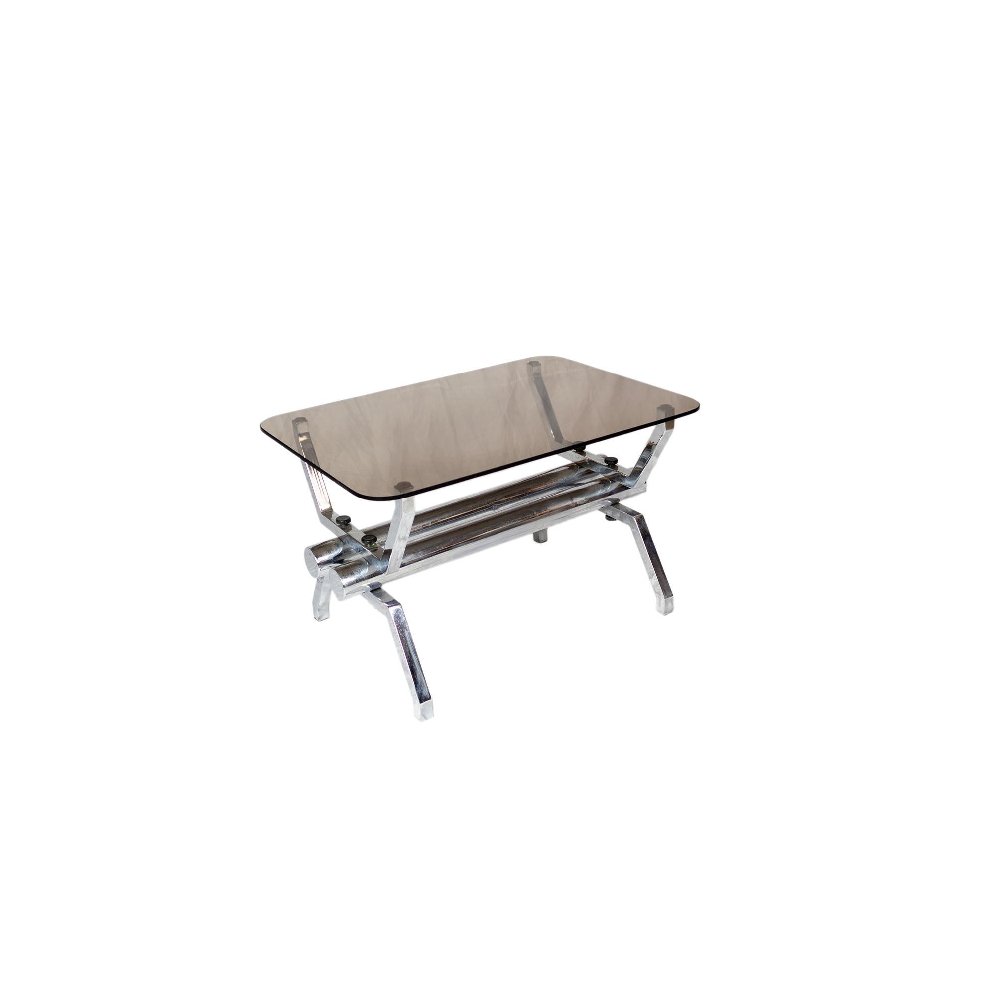 A tubular coffee table, designed and produced in Italy during the 1970's. 
The structure is made of chromed metal with the top in smoked glass, in good condition, circa 1970 
Milan, Italy
