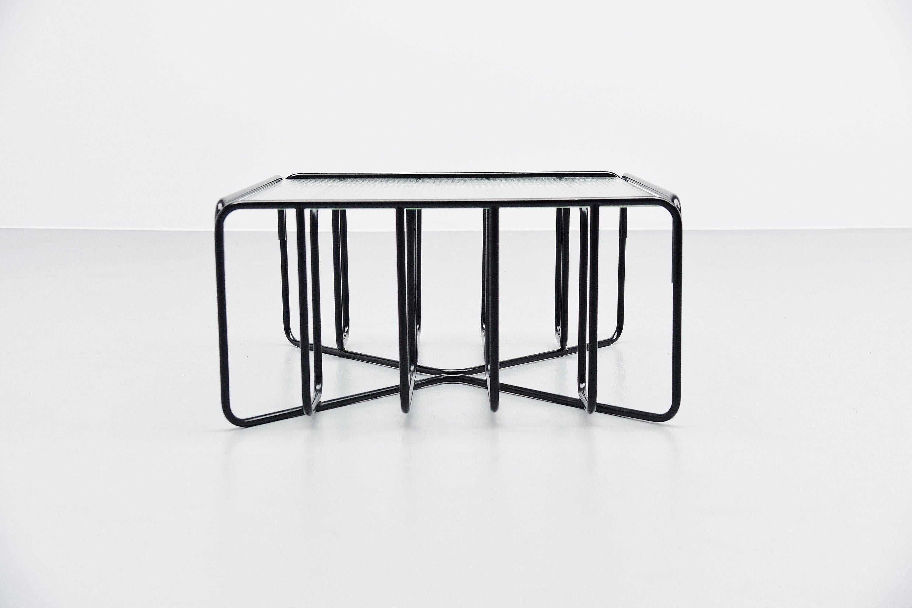 Fantastic modernist coffee table with made by unknown manufacturer, Holland, 1950. This table has a black painted tubular metal frame and a reinforced glass top. Very nice sculptural coffee table, super made. I have seen and had this table before