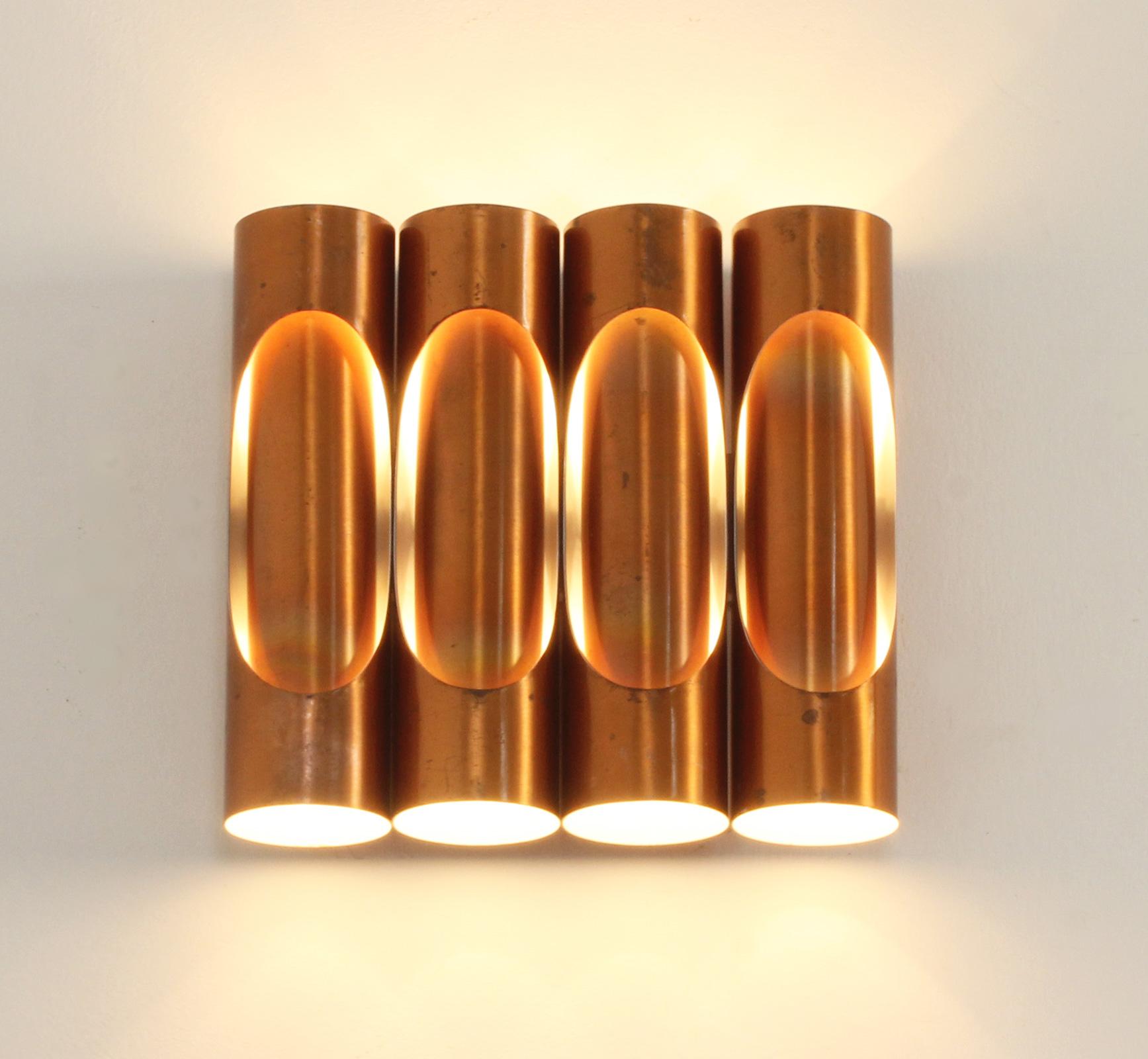 Tubular copper sconce with four parts from 1960's, Spain. Copper elements with white lacquered interior and two light bulbs each tube.
