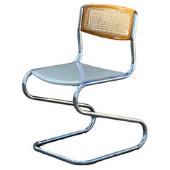 Tubular Frame and Cane Cantilever Chairs 