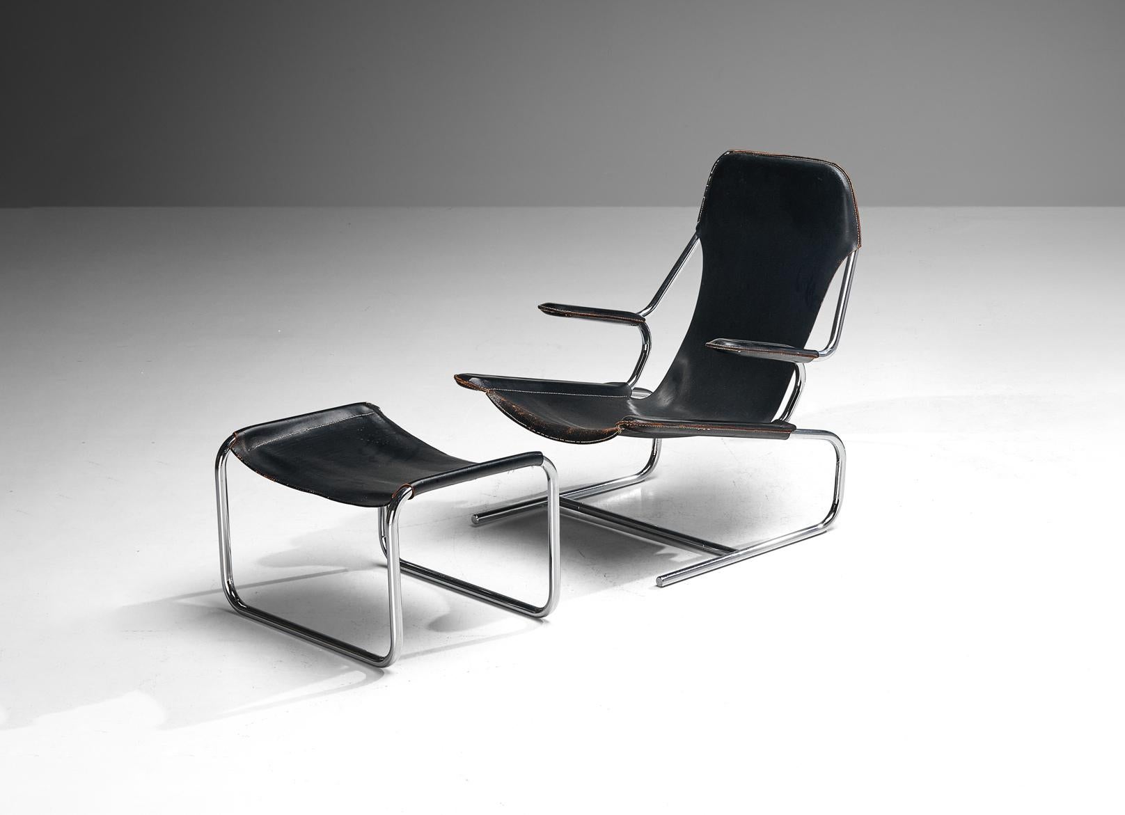 Armchair and ottoman in steel and leather, Europe, 1950s.

Modern tubular armchair and matching ottoman. These items are made of bent tubular steel with black saddle leather upholstery. Beautiful curved lines combine into a modern and clean design.