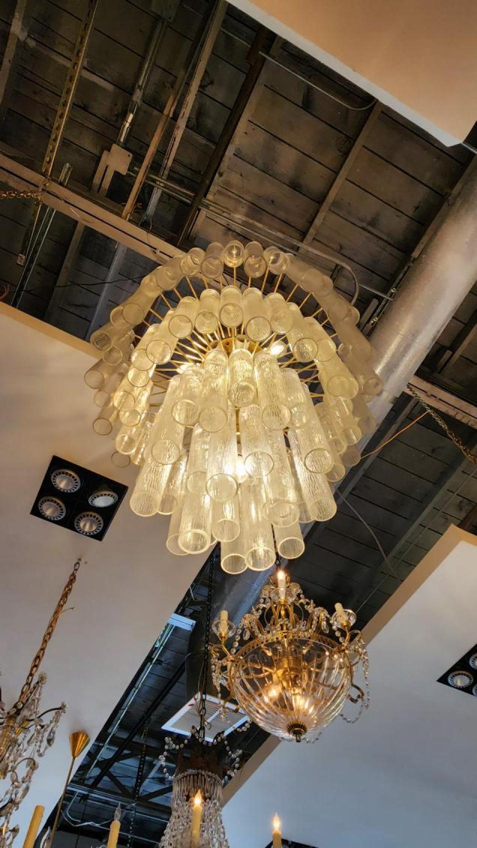 Large contemporary Murano glass chandelier in the style of venin. Murano lamp in traditional Italian mid-century style but of later production. The Murano fixture is composed of 48 transparent tubular formed crystal elements in various sizes. New
