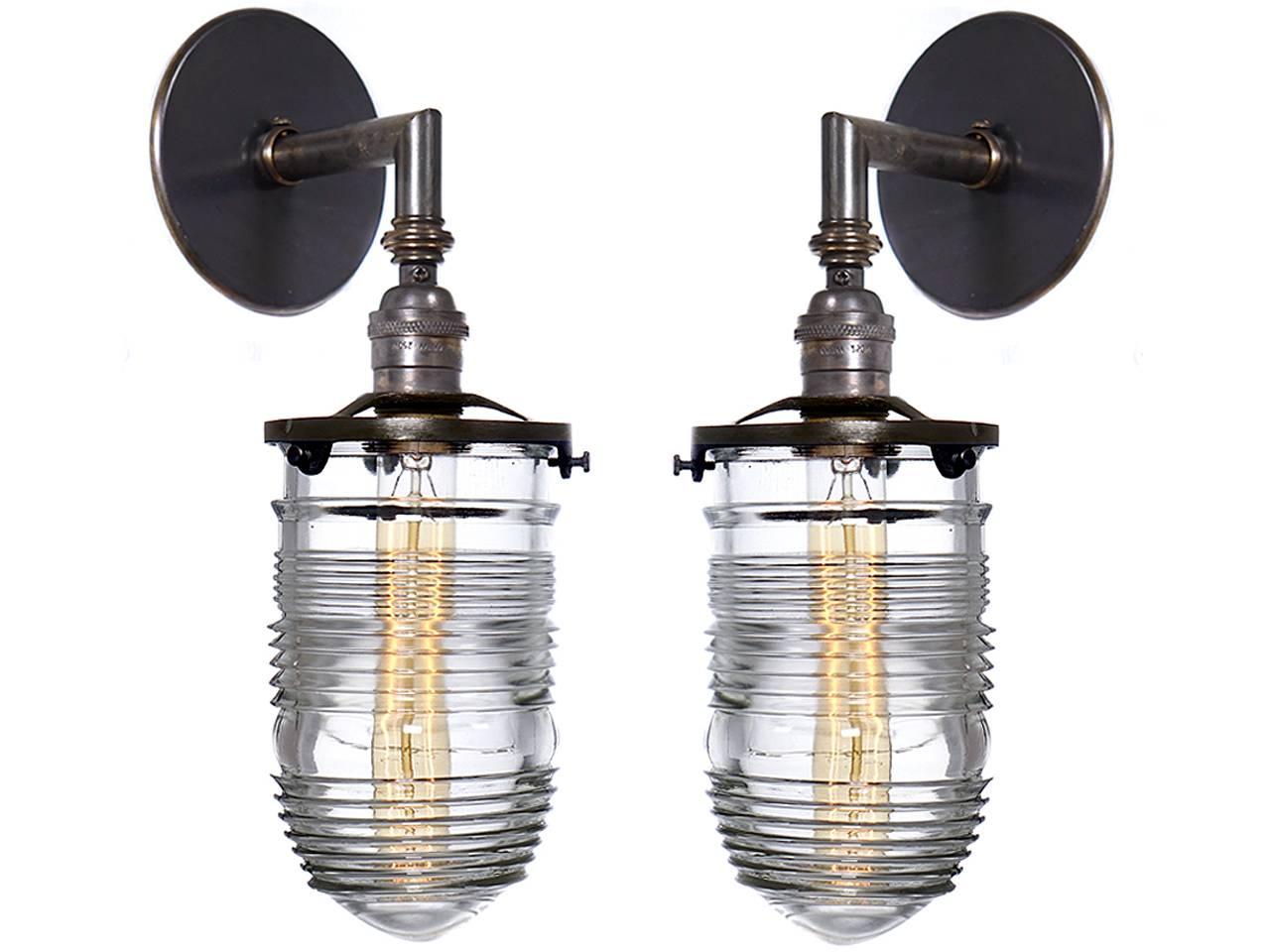This small heavy glass lamp is just the right size. It has a 4.5 inch diameter lens and is as with all prismatic glass it sheds a beautiful even light and is as simple as can be. We have a number of these in stock. Try different bulbs for a