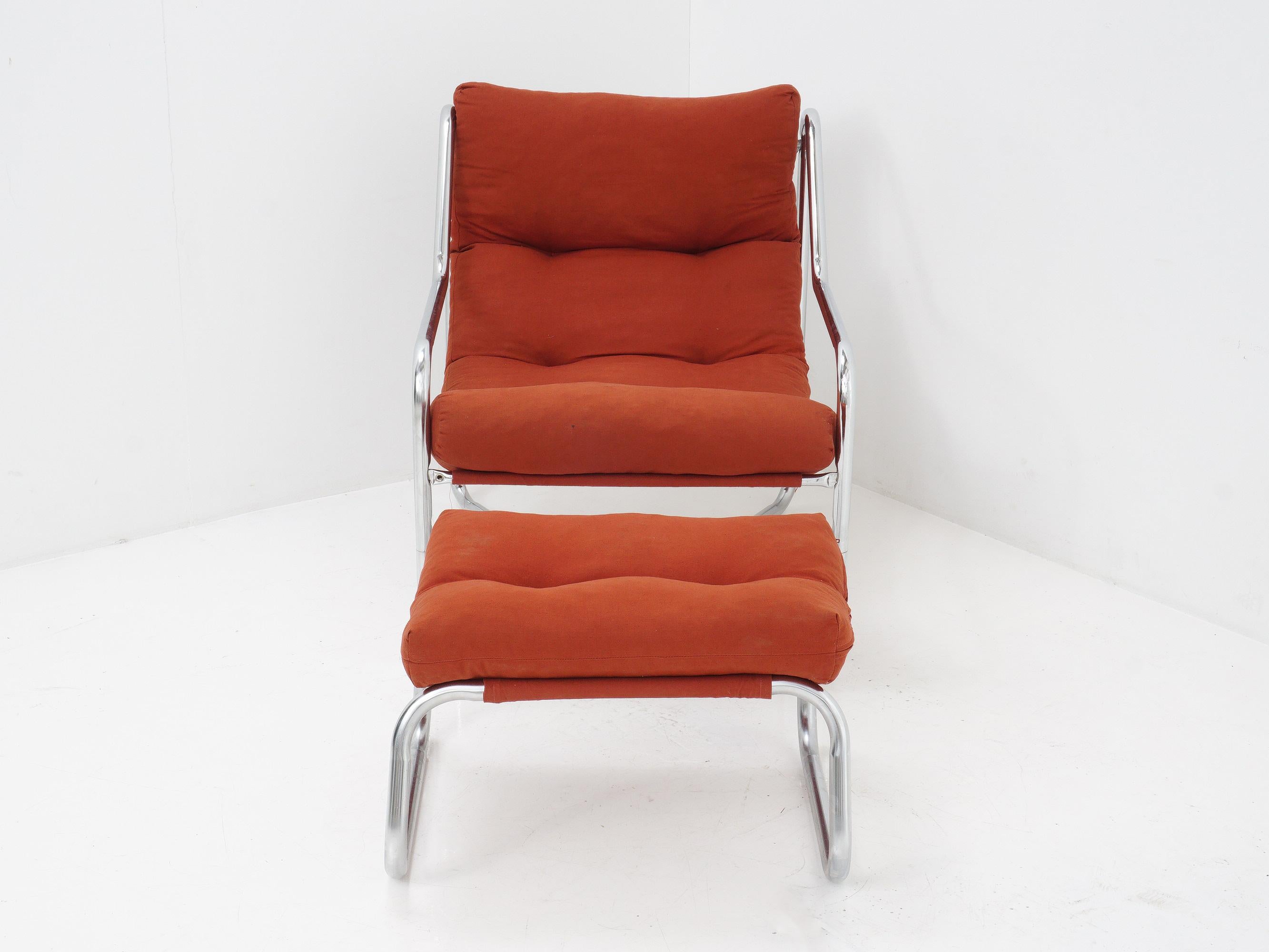 Add a pop of color to your space with this rust-red lounge chair and ottoman. The tubular chrome frame gives it a retro edge that's perfect for any mid-century modern enthusiast.

- 27.5