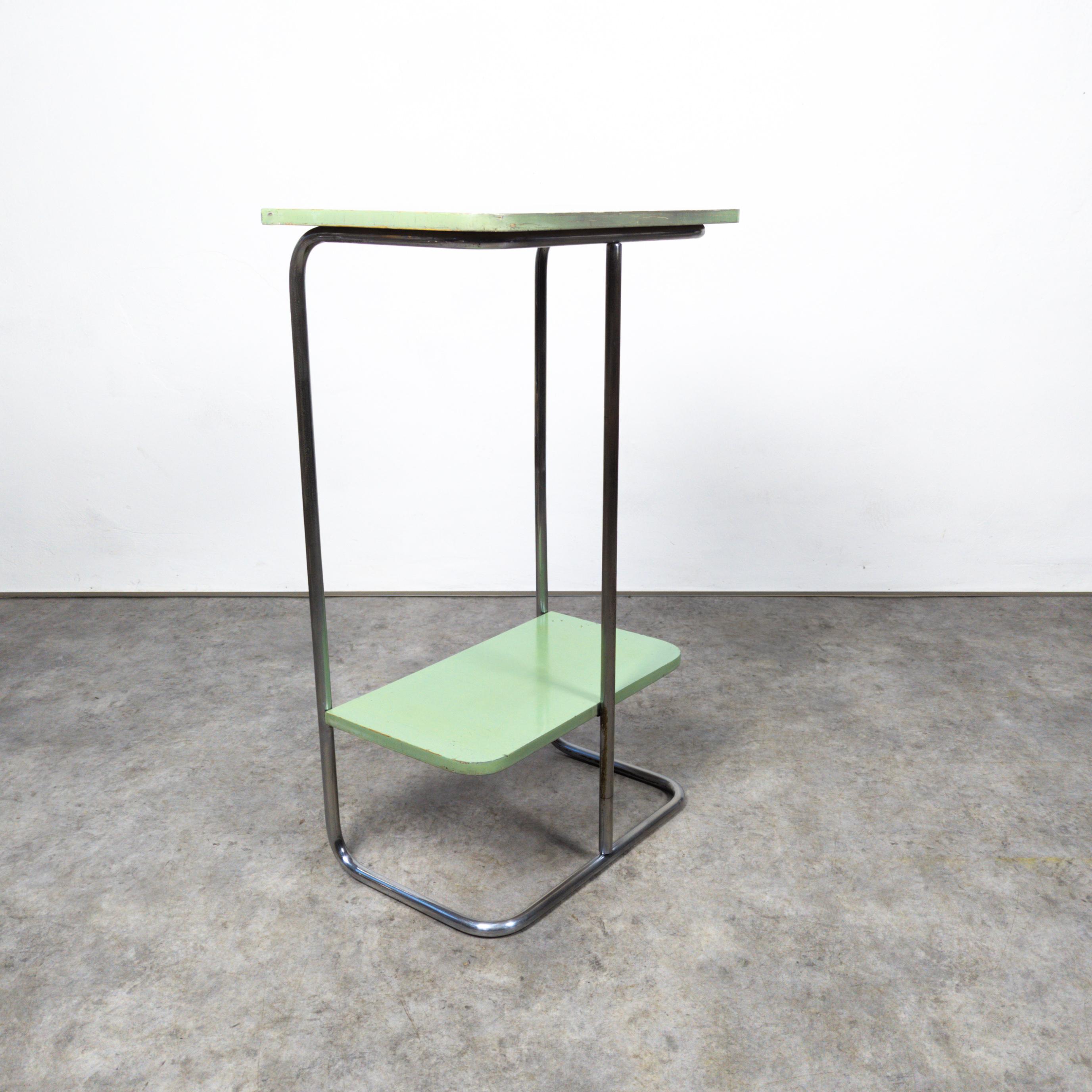 Unique bauhaus style tubular steel console table produced by Slezák, former Czechoslovakia in the 1930s. Made of chrome plated tubular steel and green lacquered beech wood this piece is fine example of Czech functionalism. In very well preserved