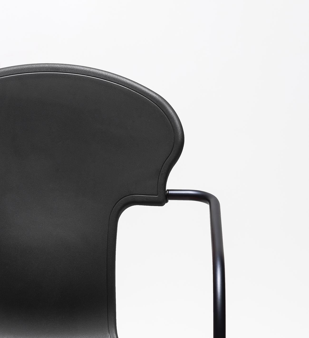 In 2008 Oscar Tusquets reviewed his famous Various chair design, and came up with this smaller and updated version presented in a painted Anodic Black.

The seat is available in a white or black gas injected polypropylene and upholstered in BD