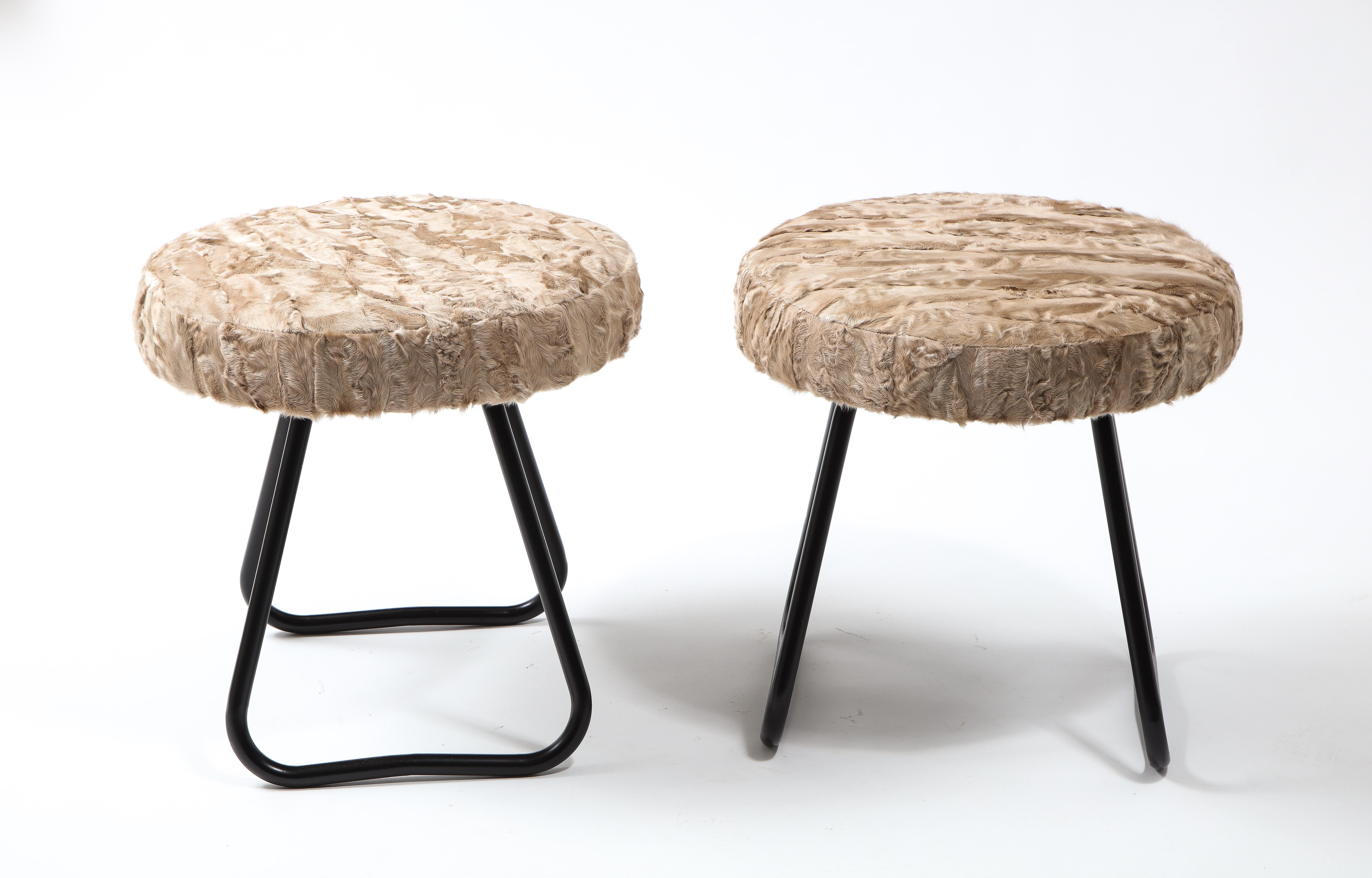 Pair of stools with a bent tubing frame, enameled finish with upholstered top.