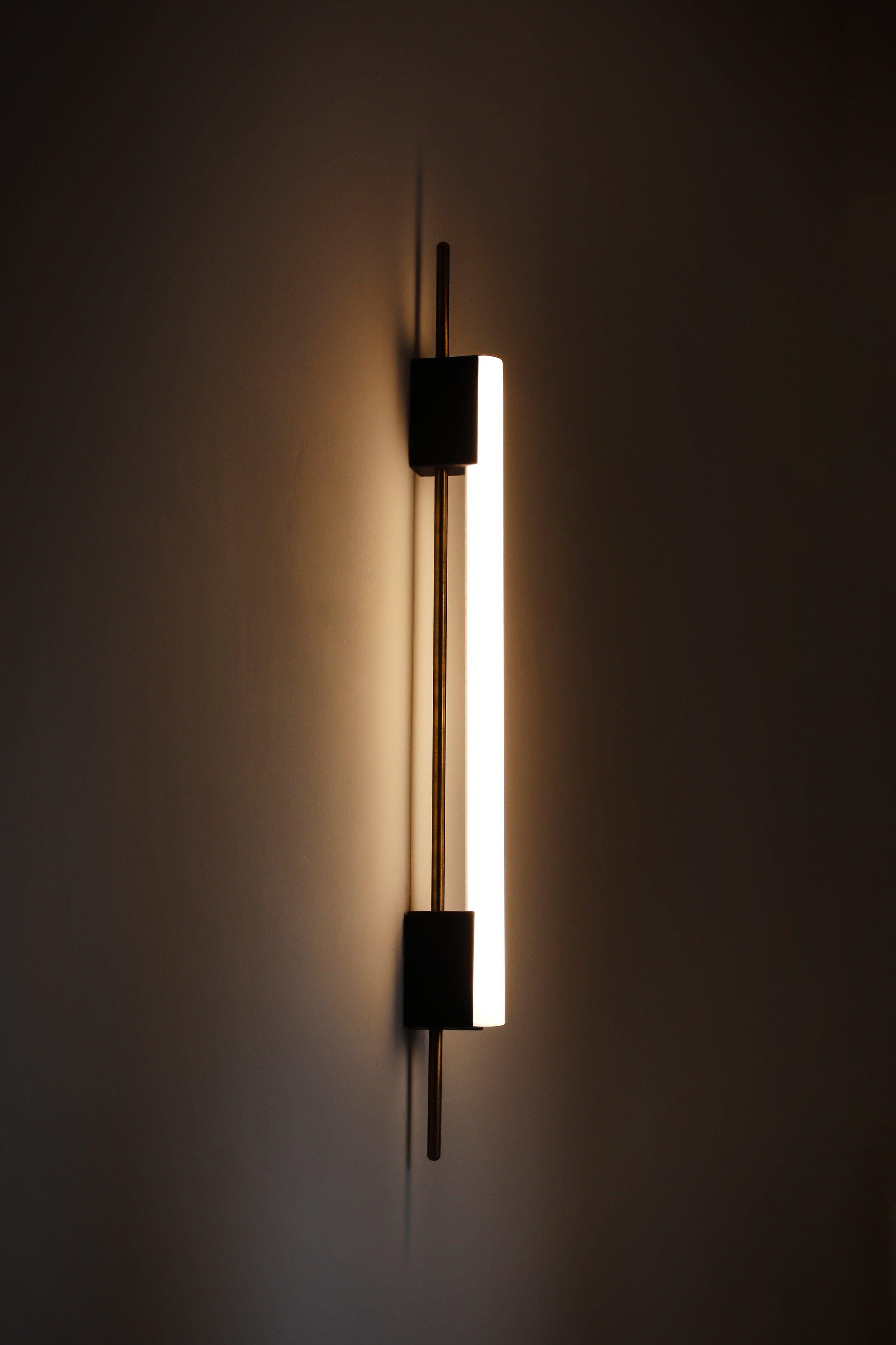 Tubus 70 wall light by Contain.
Dimensions: D 3.2 x W 70 x H 7.5 cm.
Materials: brass and 3D printed PLA structure.
Available in different finishes. 

All our lamps can be wired according to each country. If sold to the USA it will be wired for