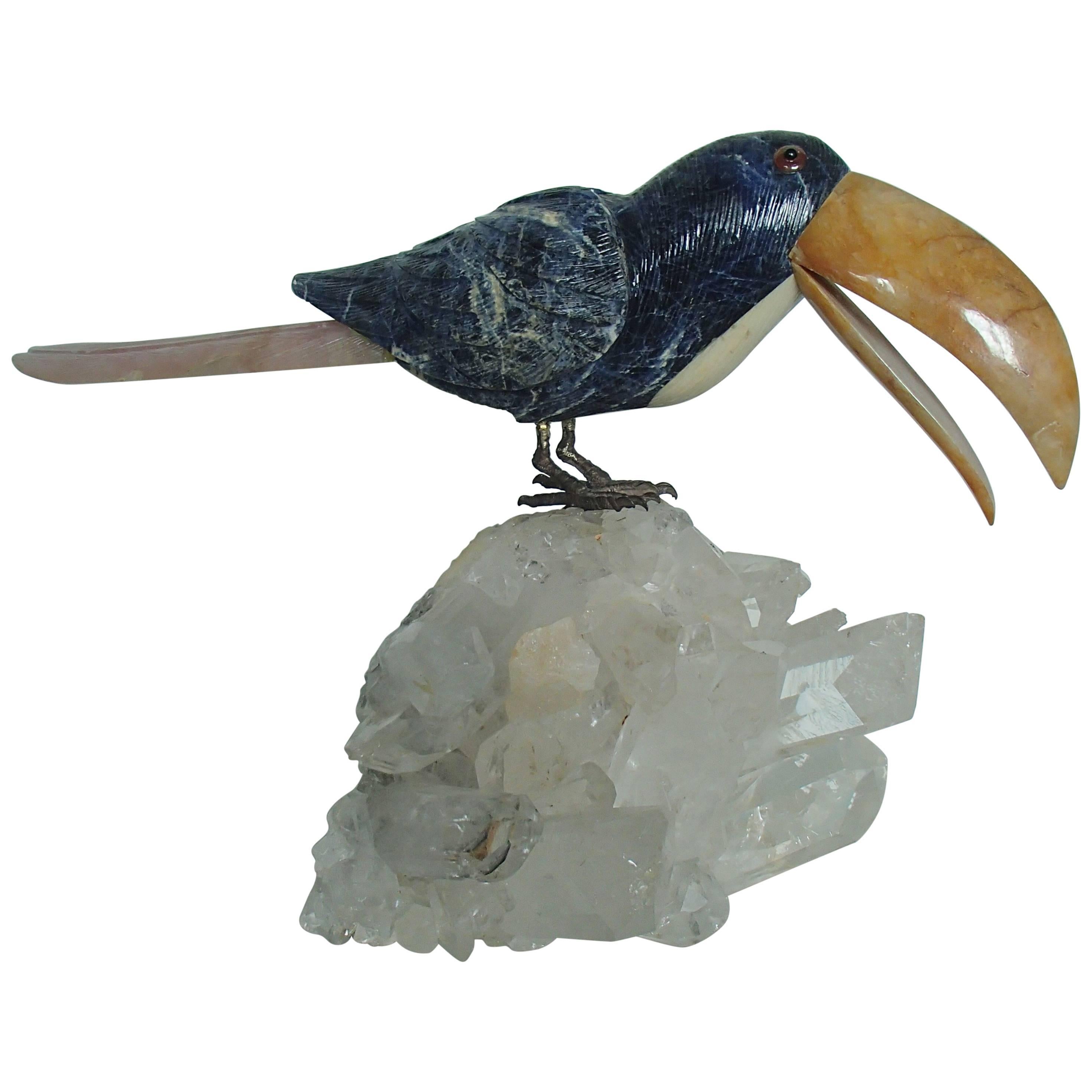 Tucan Sitting on a Cristall Made of Sodalith and Rose Quarz For Sale