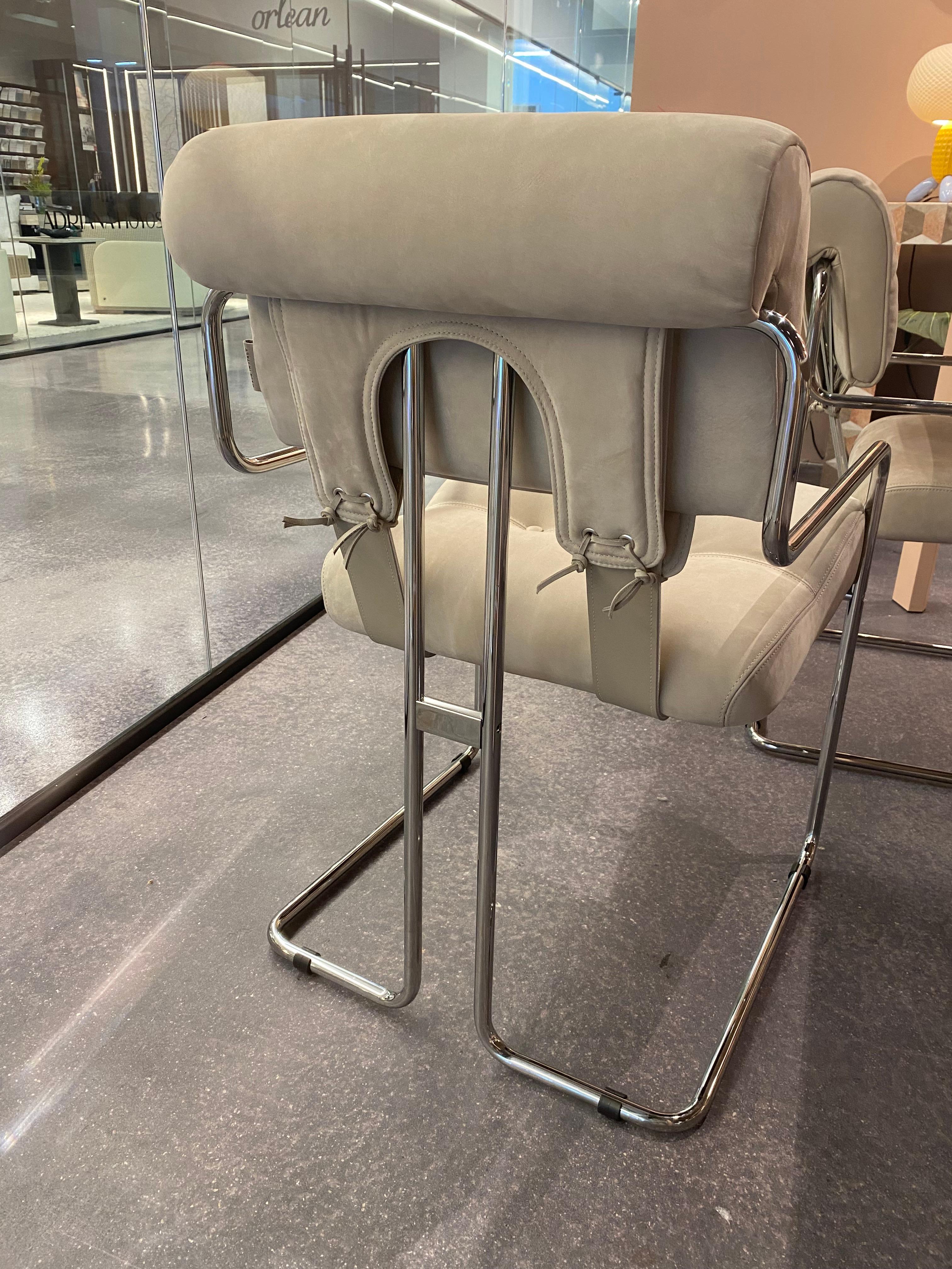 The Tucroma chair, an iconic design by Guido Faleschini from 1971.  These reproductions are upholstered in a light taupe suede with a tubular chrome frame.  Incredibly soft and comfortable..  Gorgeous 1970’s design.  Floor samples in near perfect
