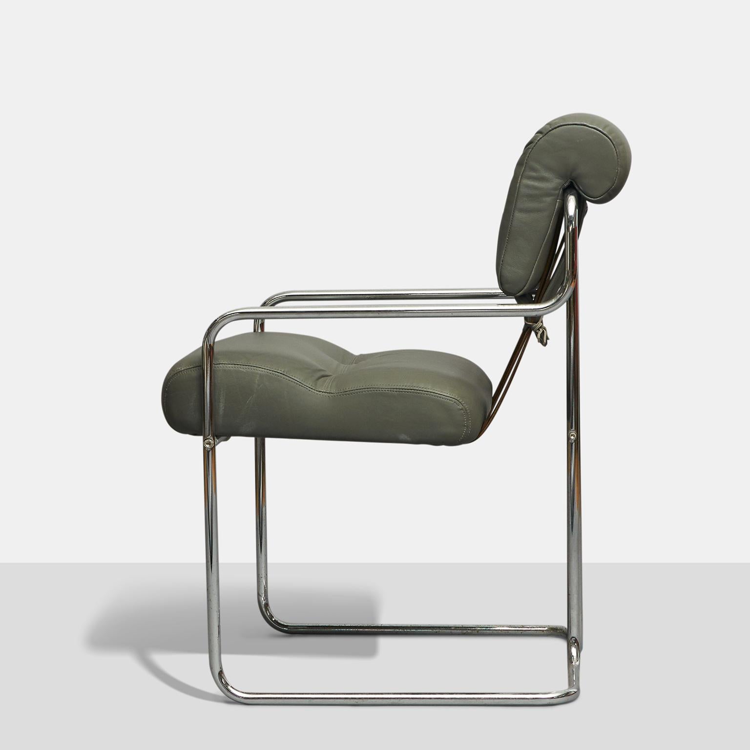 A set of Tucroma dining chairs designed by Guido Faleschini in 1972 and produced in Italy by Mariani for Leon Rosen's Pace Collection. Simple tubular chrome base with soft grey leather upholstery. Leather lacing in the back with leather straps.