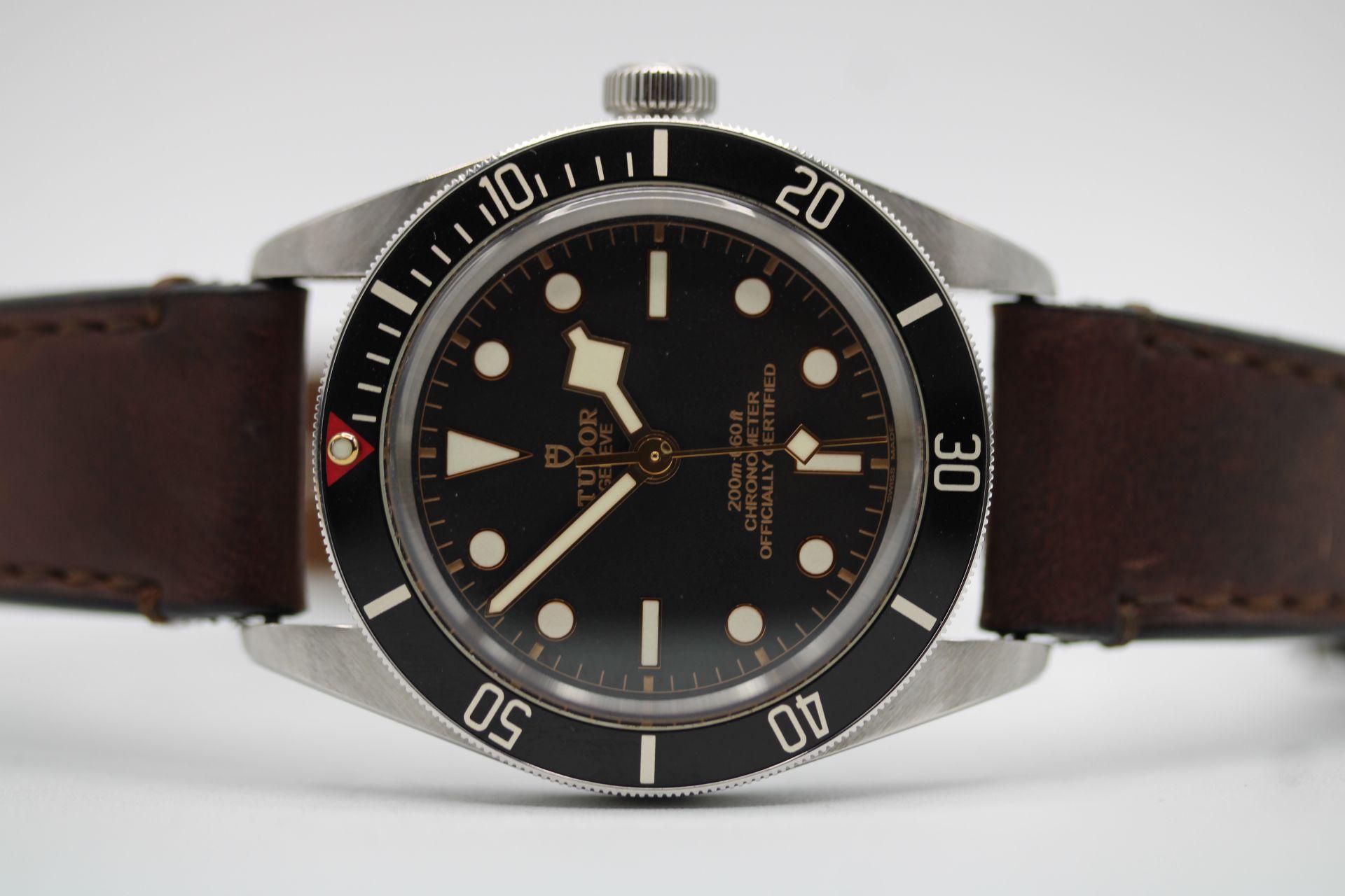 An immaculate example of this 39mm stainless steel Tudor Black Bay Fifty Eight, this being the M79030N-0002 model it comes on its original brown leather strap.

39mm stainless steel case with unidirectional rotatable bezel in black. Waterproof to