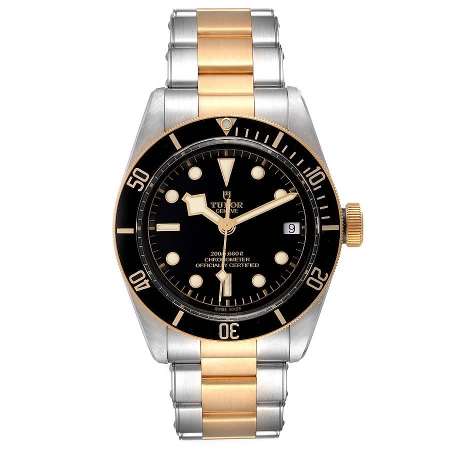 Tudor Black Bay Steel Yellow Gold Black Dial Mens Watch 79733 Box Card. Automatic self-winding movement. Stainless steel oyster case 41.0 mm in diameter. Tudor logo on a yellow gold crown. 18k yellow gold unidirectional rotating bezel. Scratch