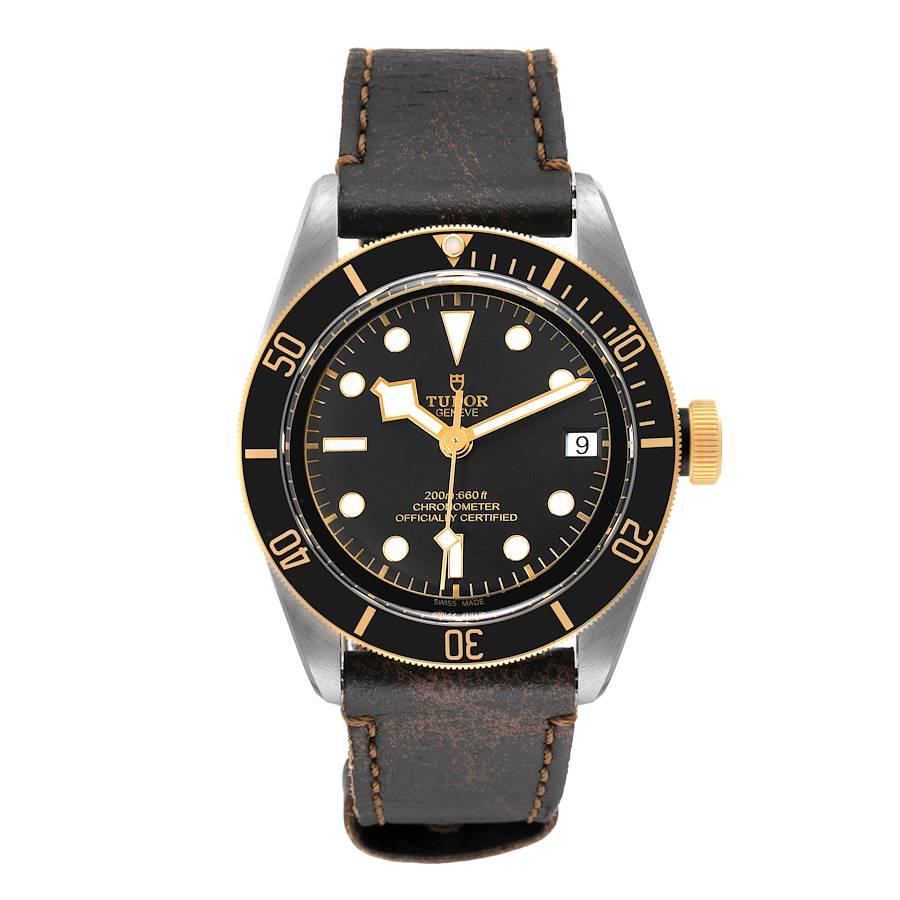 Tudor Black Bay Steel Yellow Gold Black Dial Mens Watch 79733 Box Card. Automatic self-winding movement. Stainless steel oyster case 41.0 mm in diameter. Tudor logo on a yellow gold crown. 18k yellow gold unidirectional rotating bezel. Scratch