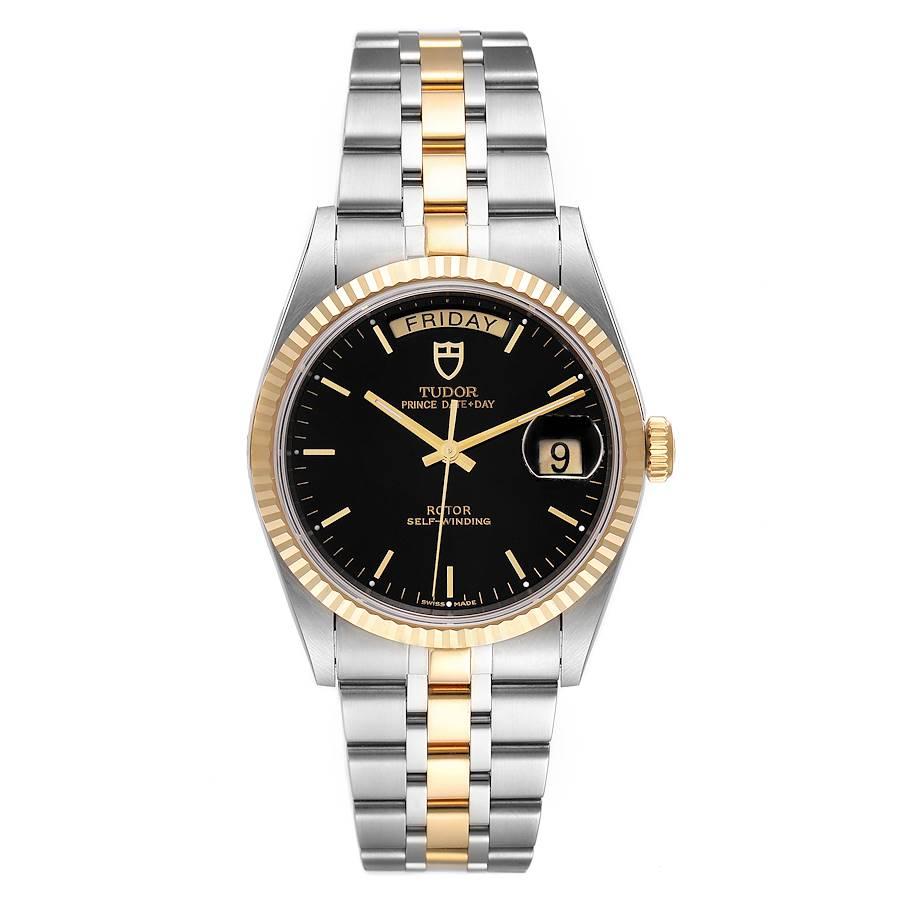 Tudor Day Date Black Dial Steel Yellow Gold Mens Watch 76213 Unworn. Automatic self-winding movement. Stainless steel round case 36.0 mm in diameter. 18k yellow gold fluted bezel. Scratch resistant sapphire crystal. Black dial with raised baton hour