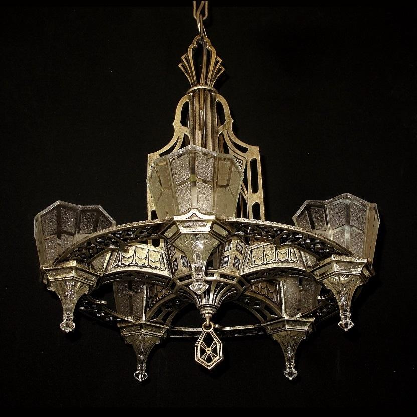 With a definite Tudor/Gothic look this 1920s - 30s fixture is a wonderful example of the European influence which was a very popular design style during the 1920s and into the early 30s. This fixture retains it original finish and patina with just a
