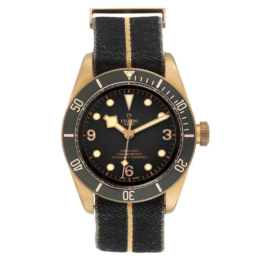 Tudor Heritage Black Bay Bronze Black Dial Mens Watch 79250 Box Card. Automatic self-winding movement. Bronze oyster case 41.0 mm in diameter. Tudor logo on the crown. Uni-directional rotating bronze bezel with a matte black top ring. Scratch