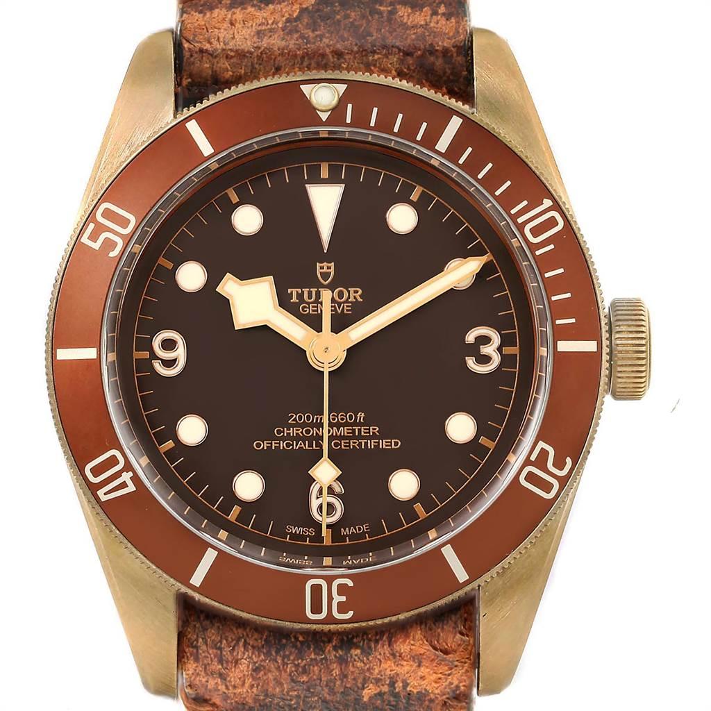 Tudor Heritage Black Bay Bronze Dial Mens Watch 79250 Box Card. Automatic self-winding movement. Aluminum bronze alloy oyster case 41.0 mm in diameter. Tudor logo on a crown. Brown tachymeter bezel. Scratch resistant sapphire crystal. Bronze dial