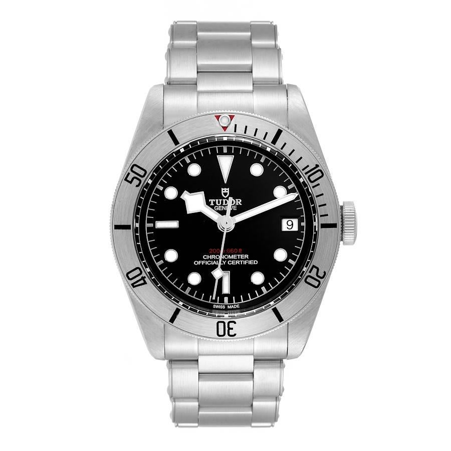 Tudor Heritage Black Bay Steel Black Dial Mens Watch 79730 Box Card. Automatic self-winding movement. Stainless steel oyster case 41.0 mm in diameter. Tudor logo on a crown. Stainless steel unidirectional rotating bezel. Scratch resistant sapphire