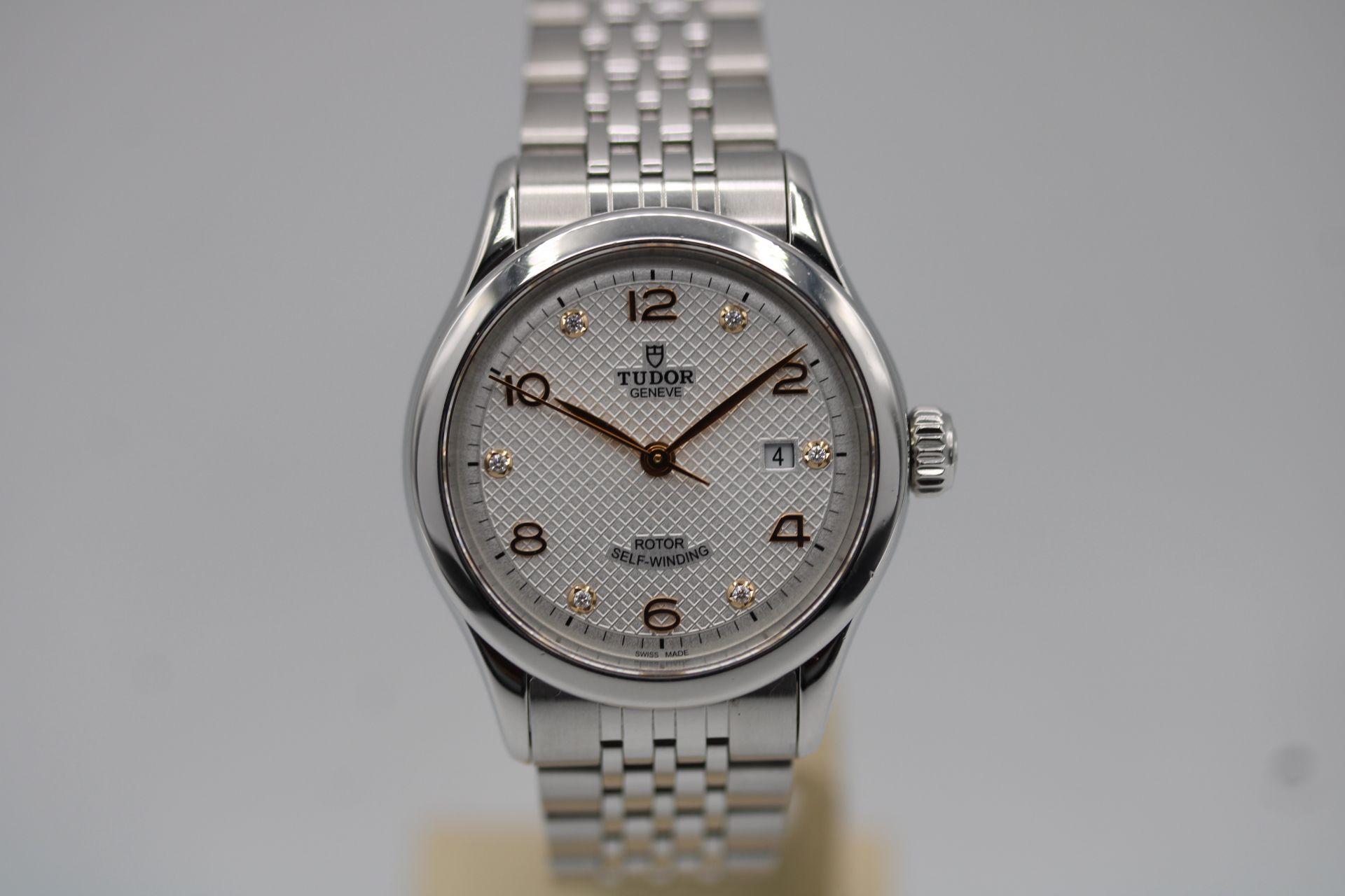 This ladies Tudor arrives as a complete full set with inner and outer boxes, both manuals and warranty card dated May 2019 in addition to our 12-month warranty.

This ladies Tudor 1926, model 91350, features a 28mm stainless steel case, white