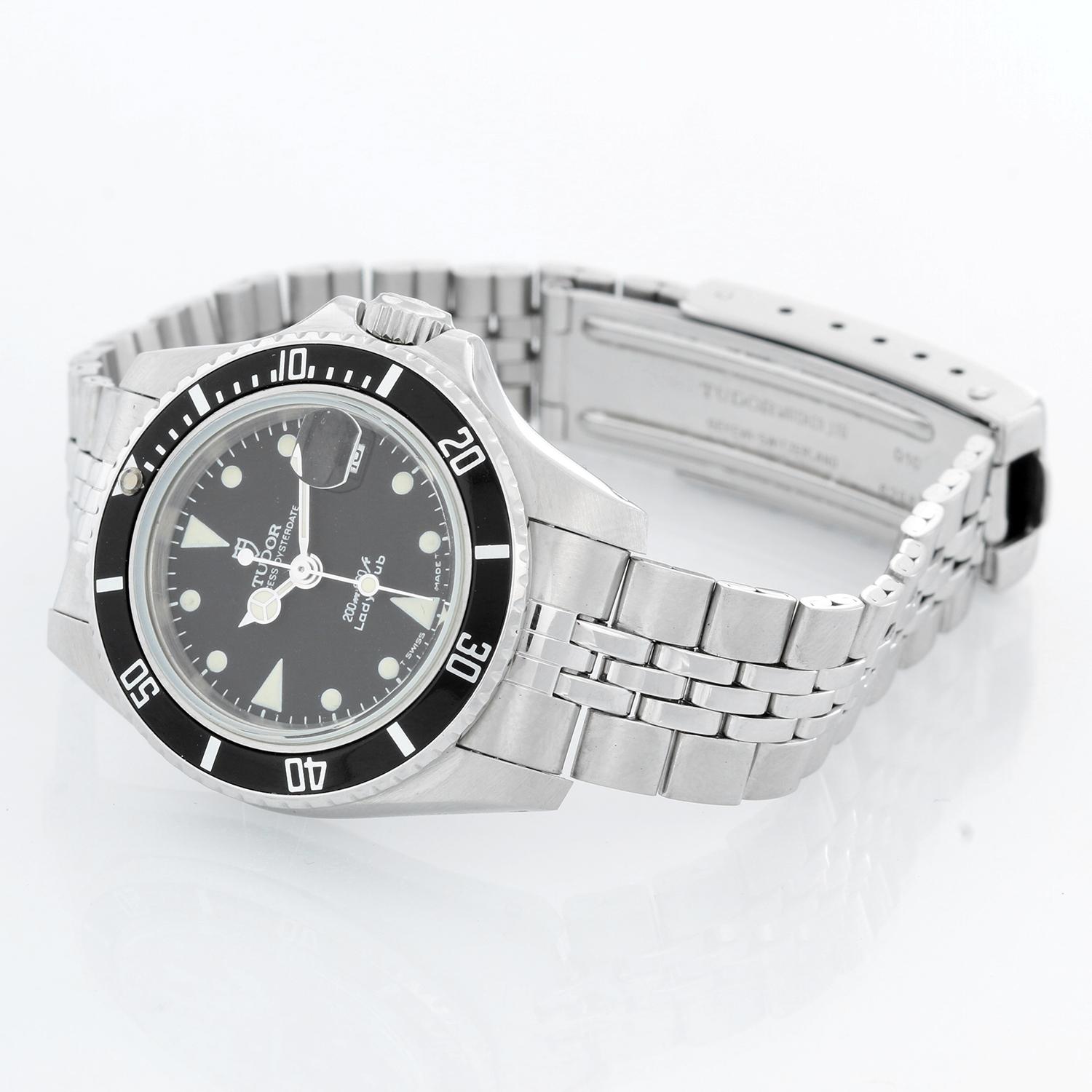 Tudor Ladies Submariner Stainless Steel Watch Ref. 96090 - Automatic winding. Stainless steel case with time lapse rotating bezel (26mm diameter). Black dial with white hour markers. Stainless steel Jubilee style bracelet. Pre-owned with custom box.