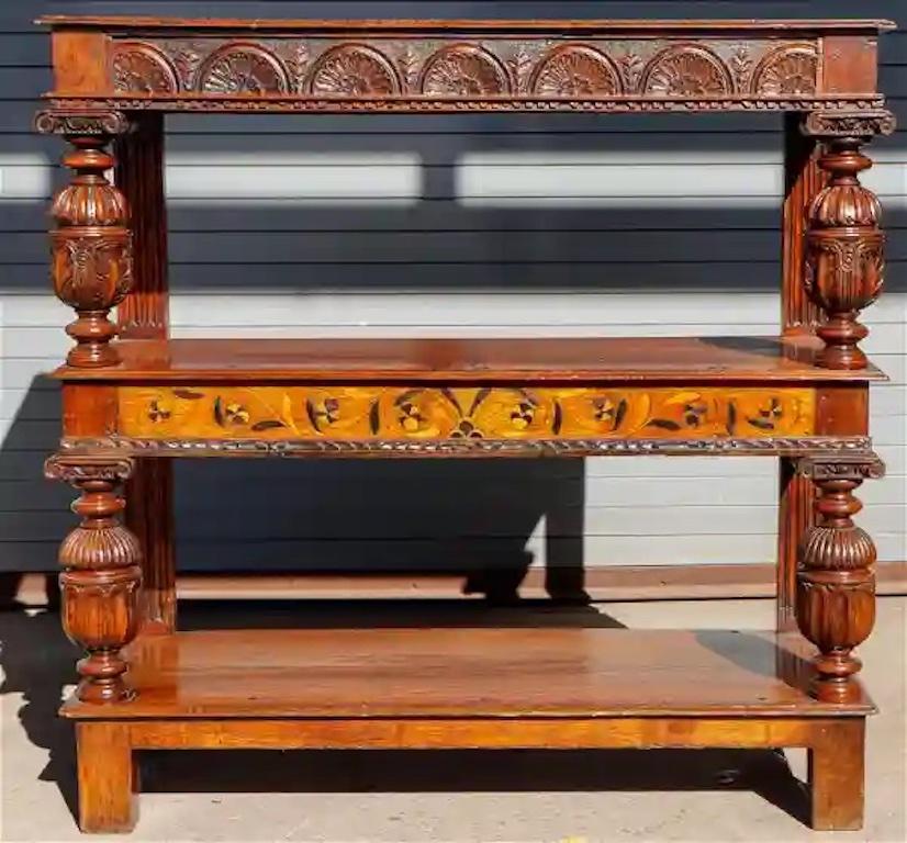 19th Century or quite possibly period 17th century tudor style triple tiered inlaid server.

Mixed woods
Great patina.
 