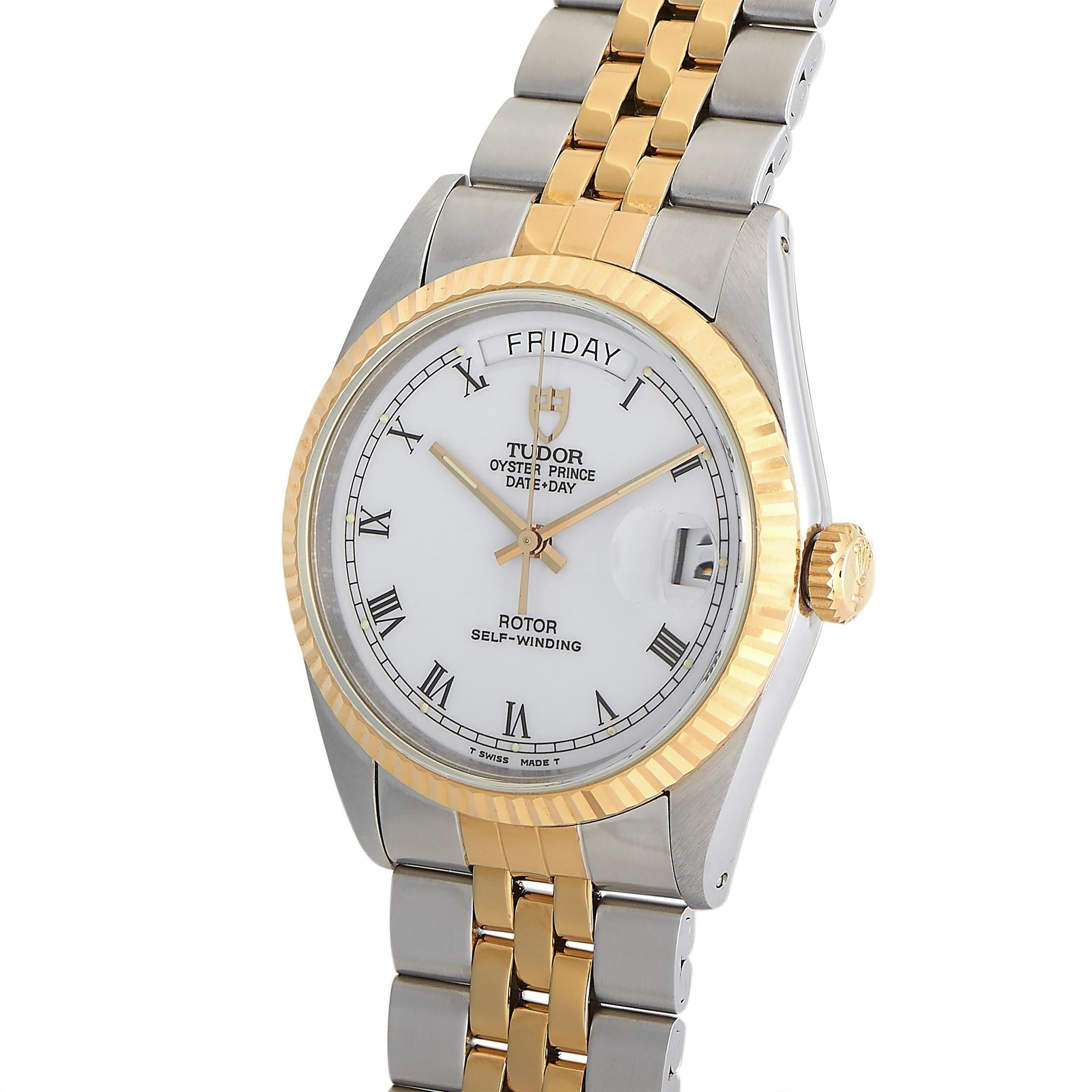 The Tudor Oyster Prince Day-Date Watch, reference number 70233, is ready to serve as a sleek, simple addition to any ensemble. 

This sophisticated timepiece features a stainless steel 36mm case accented by a fluted 18K yellow gold bezel. These
