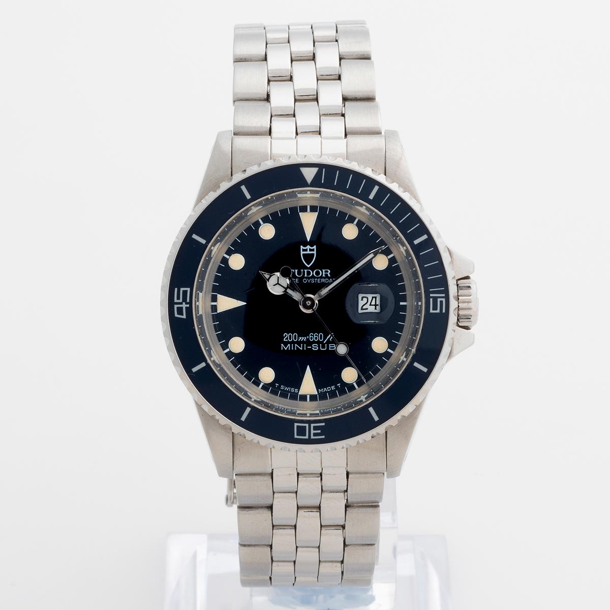 Our vintage and rare Tudor Prince Oyster Date Mini Sub features a 33mm stainless steel case and blue dial with rotating bezel with blue insert, the dial and insert all being original and with coeval patination. This mini sub is one of the most best