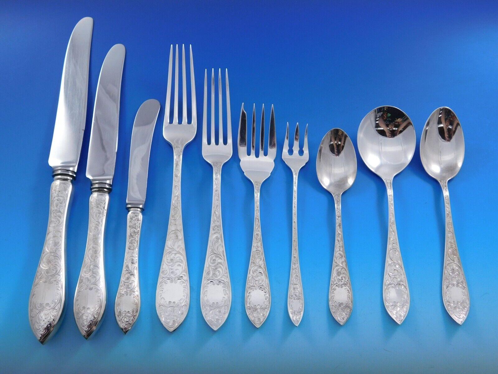 Monumental Tudor Scroll by Birks Canada sterling silver Flatware set with bright-cut design, 140 pieces. This set includes:

12 Large Dinner Knives, 10 1/8