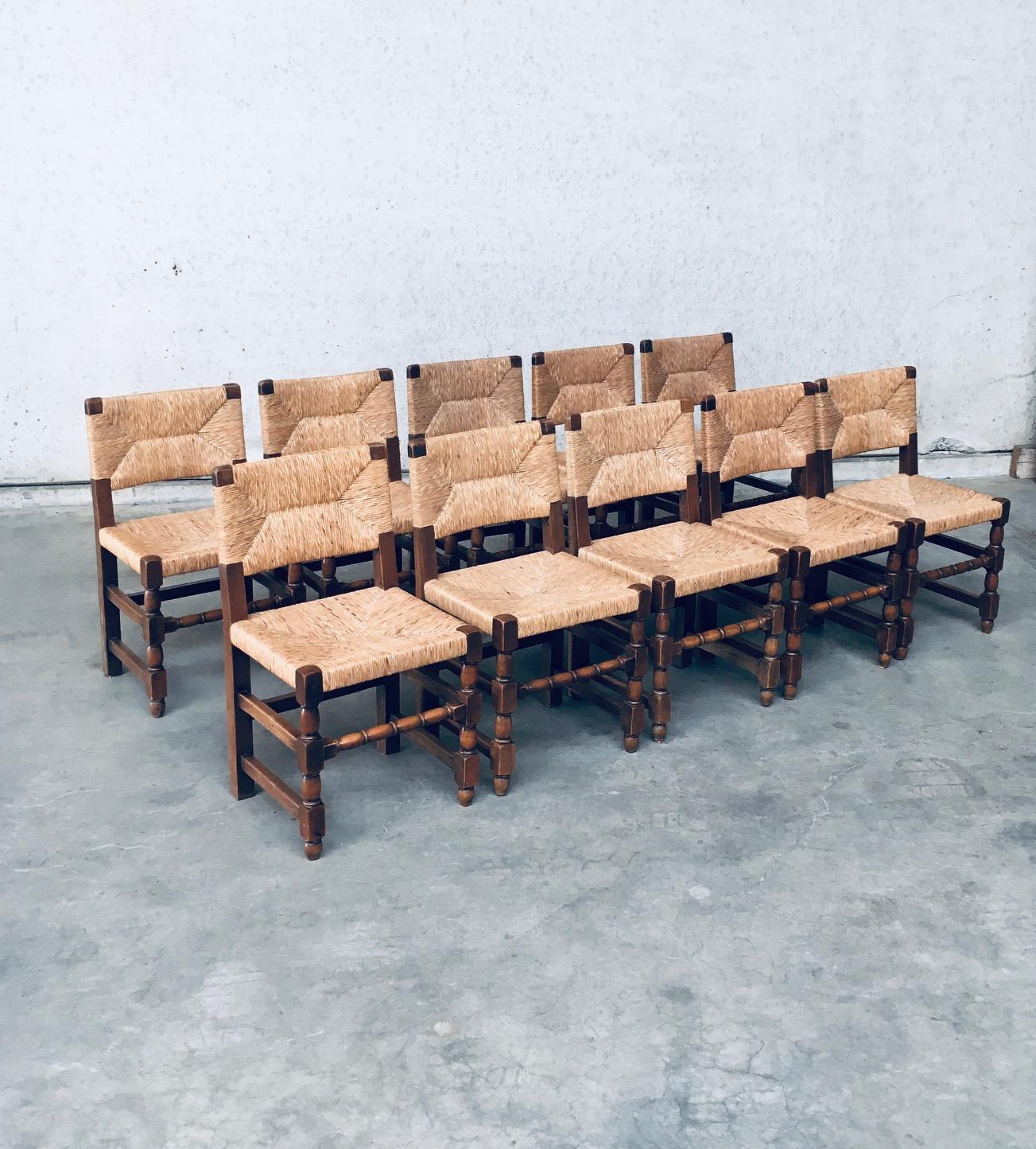 Early 20th Century Tudor Style Design Oak & Rush Dining Chair set of 10 pieces. Made in Belgium, 1930's / 40's period. Solid oak constructed with rush seat and back rest. Sculptural front legs. These chairs are in Cromwelian or Tudor style design.