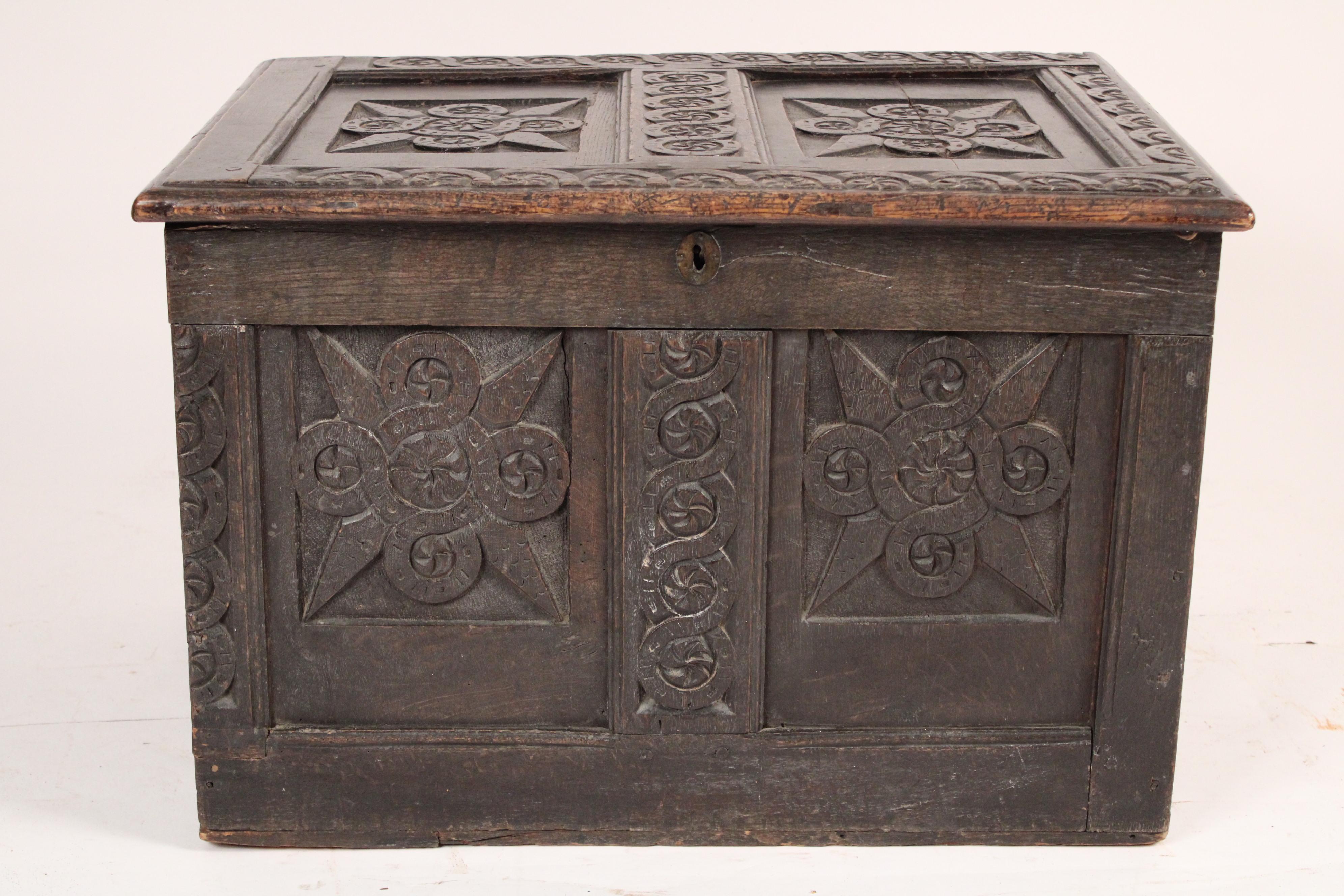 Tudor style carved oak trunk, made of 18th century and later elements. Most likely assembled circa 1920's.