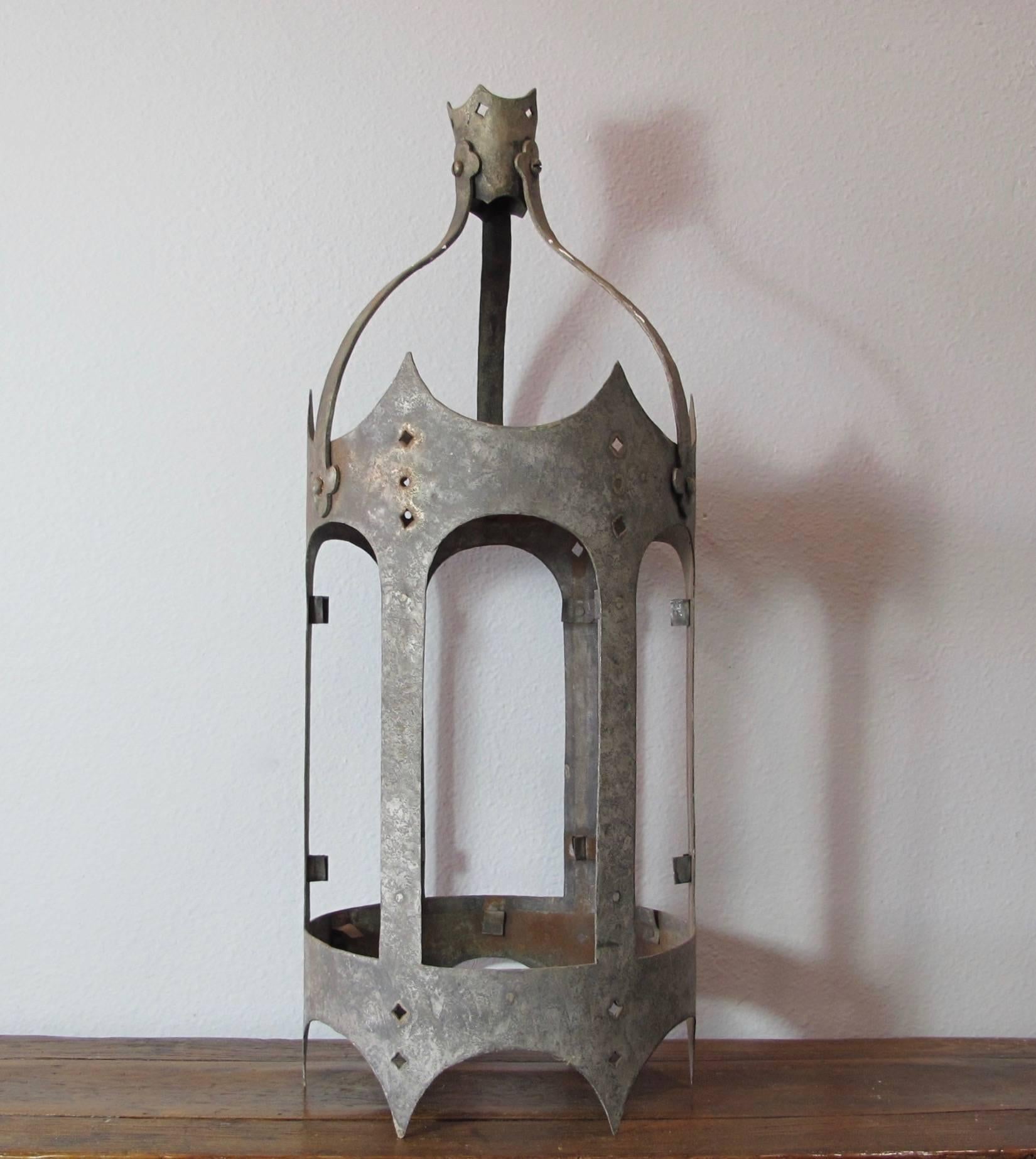 Great antique zinc lantern in the Tudor style with original patina. Not wired for electrical use, purely decorative piece. Has a beautiful coloring to it, perfect for a table or outdoor area with candles inside. Originally held glass, not included