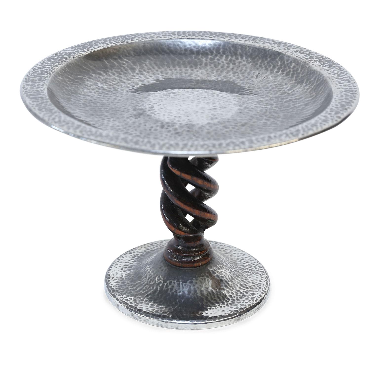 Tudric Pewter tazza, or compote, with barley-twist walnut stem. Made by W. H. Haseler's of Birmingham in a Celtic revival style for Liberty & Co of London, (circa 1900-1930). Tudric Pewter became known as 'poor man's silver' due to its shine, which